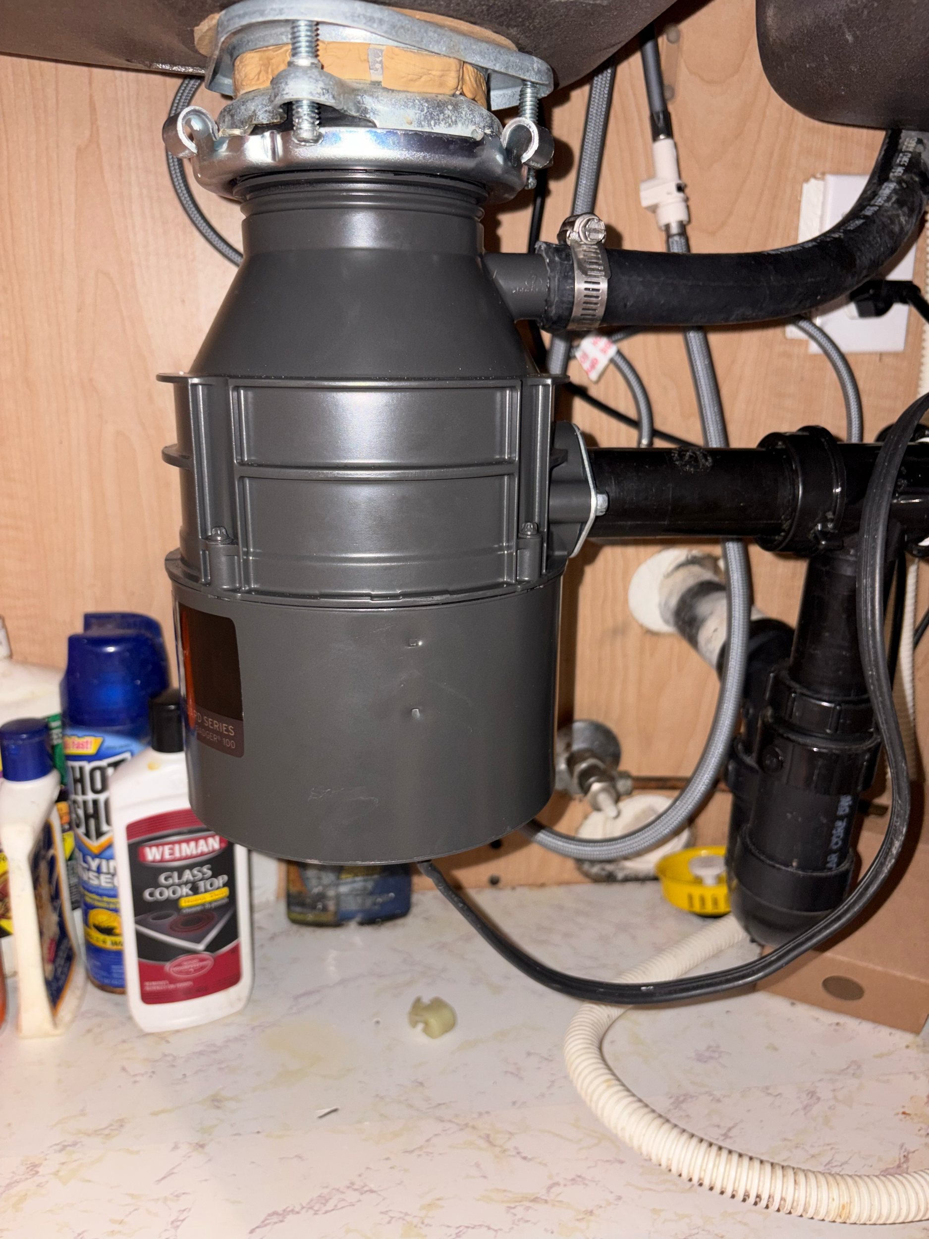 Kitchen sink area updated with new disposal unit for improved function