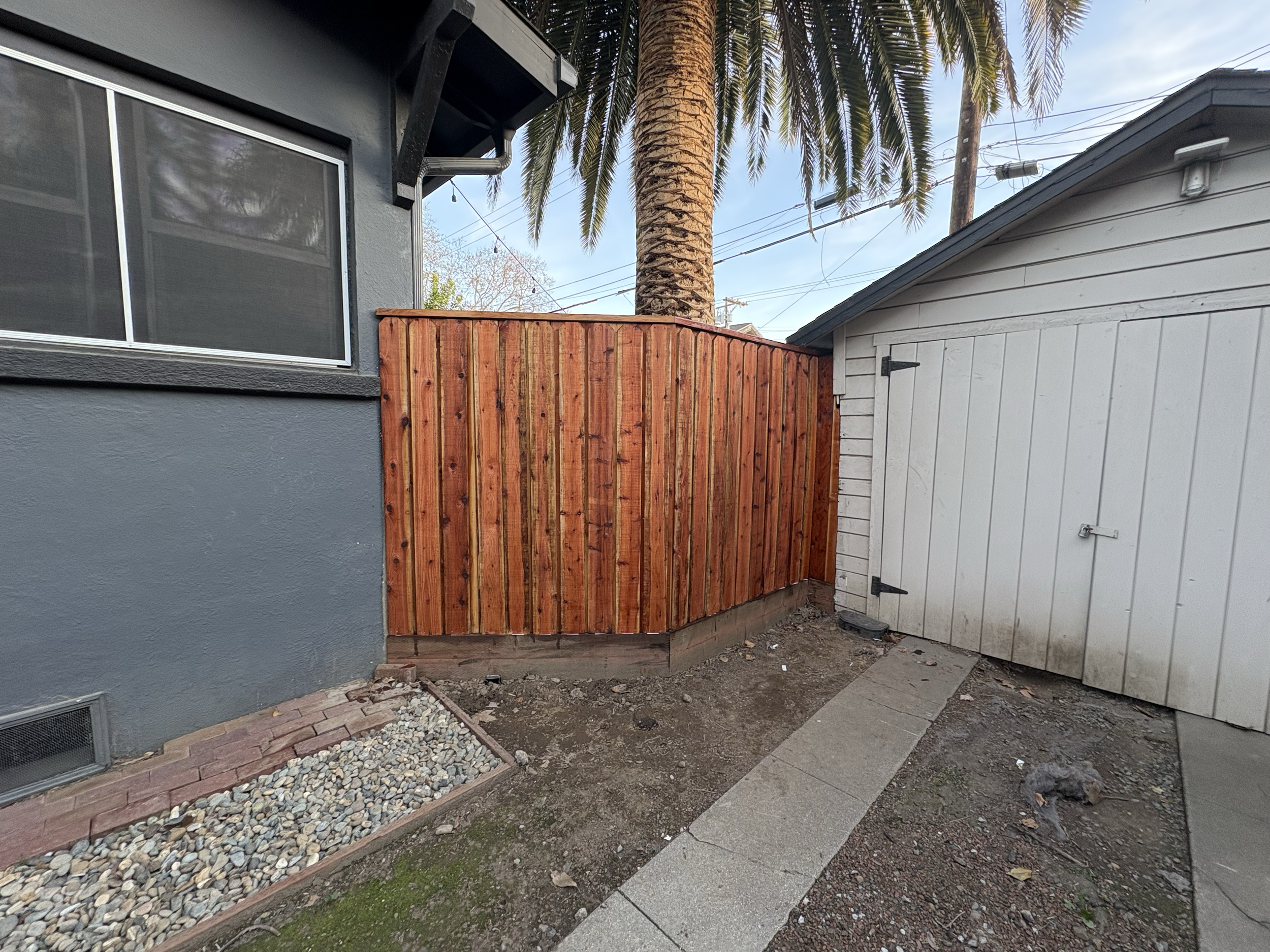 Exterior area refreshed with a wood privacy feature and updated finish for a cleaner, more polished look.