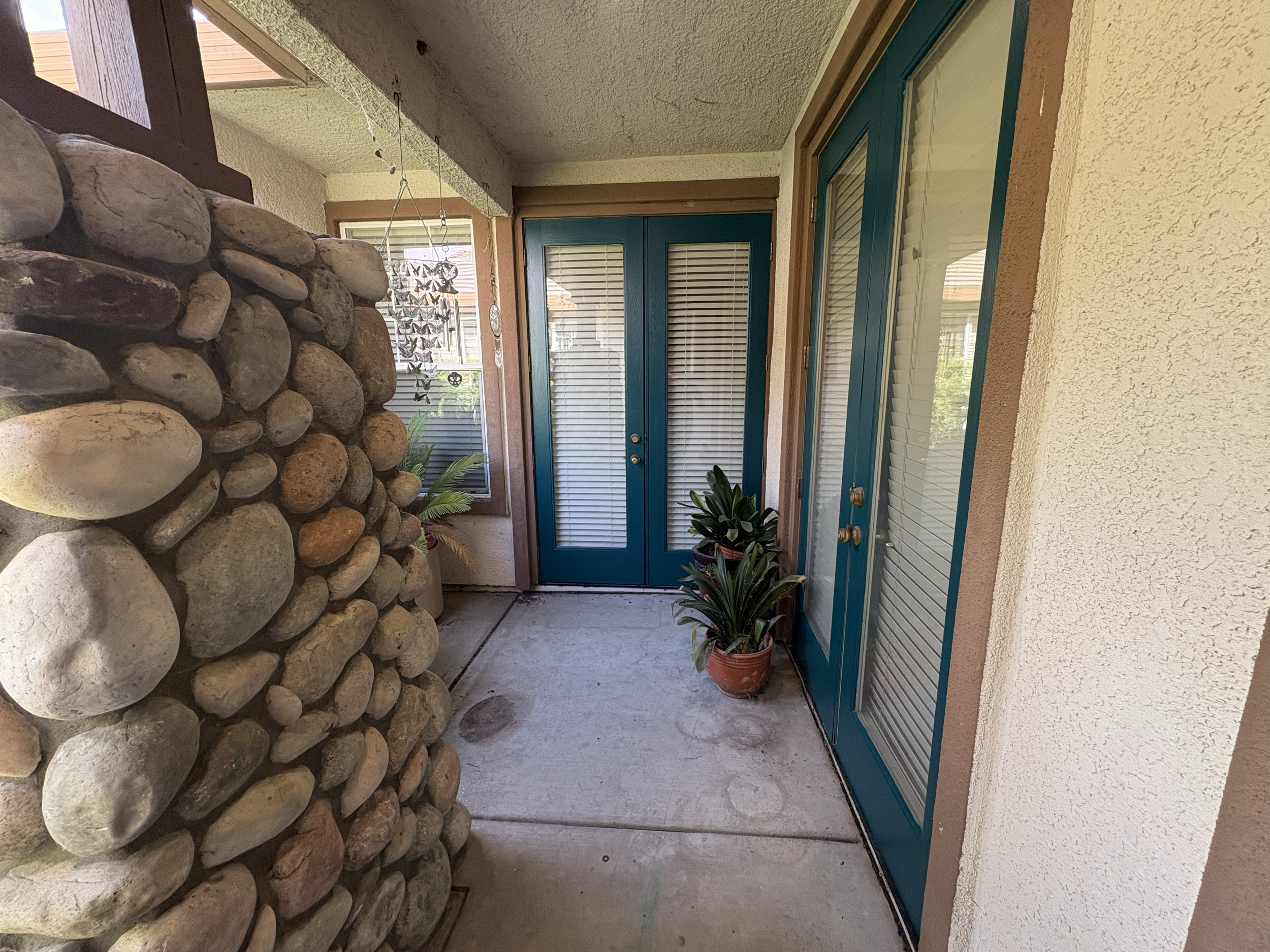 Entryway refreshed with updated door finishes for a cleaner, more polished appearance 