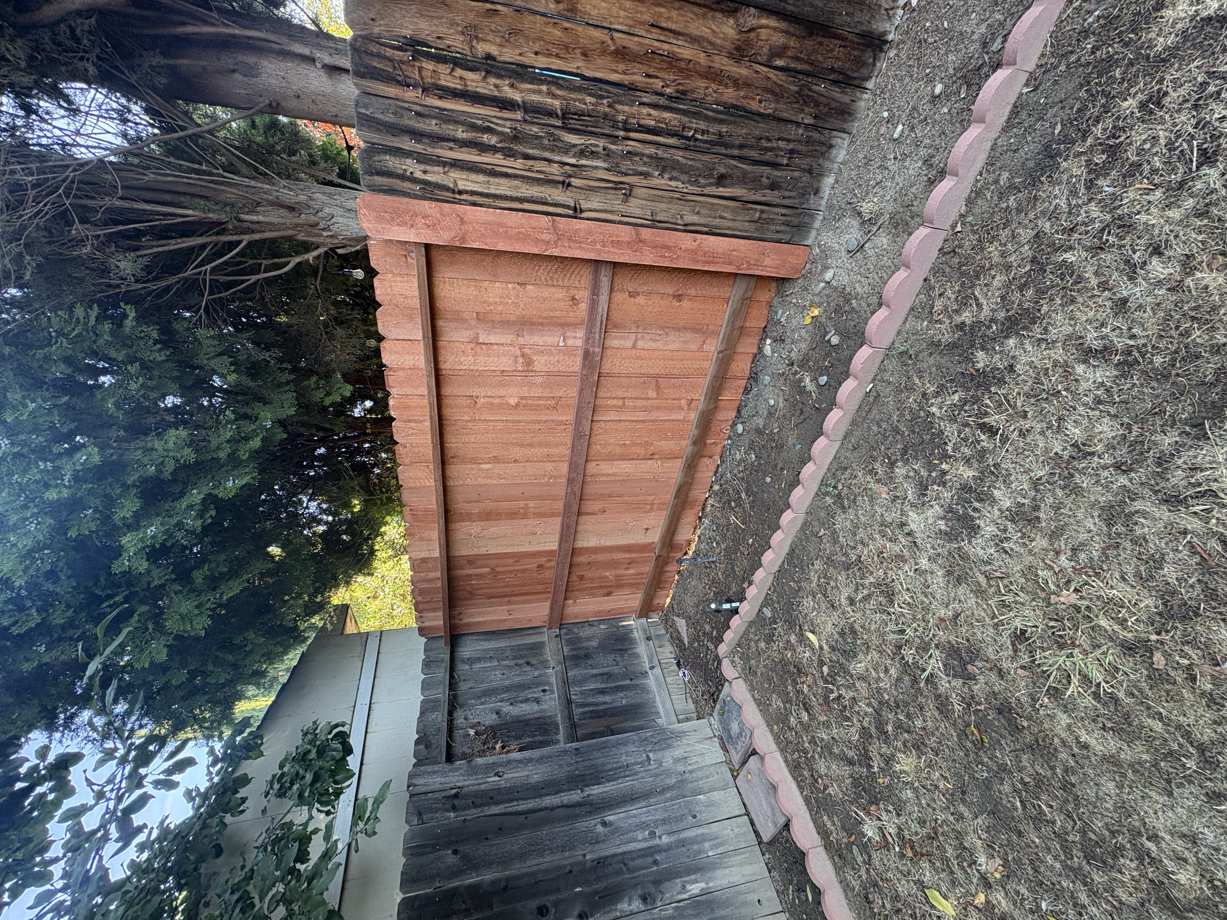 Exterior space refresh with wood privacy detailing 