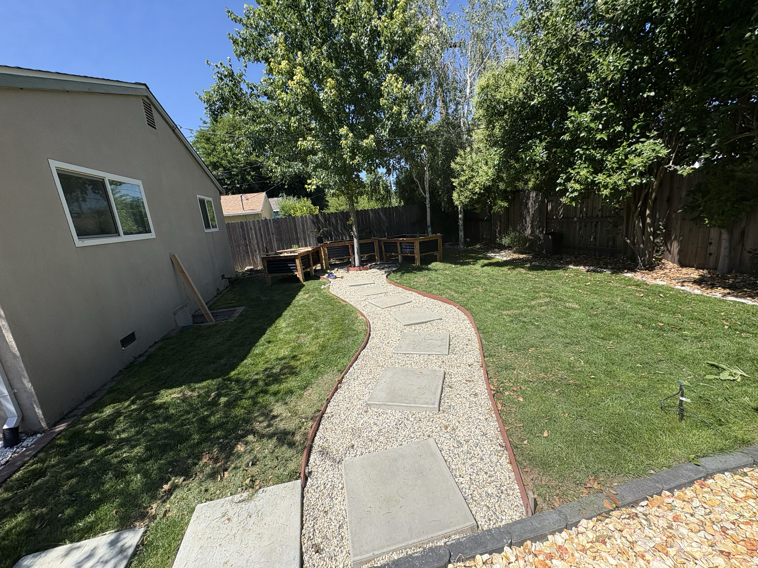 Outdoor area refreshed with new greenery and planter elements to improve overall appearance and usability