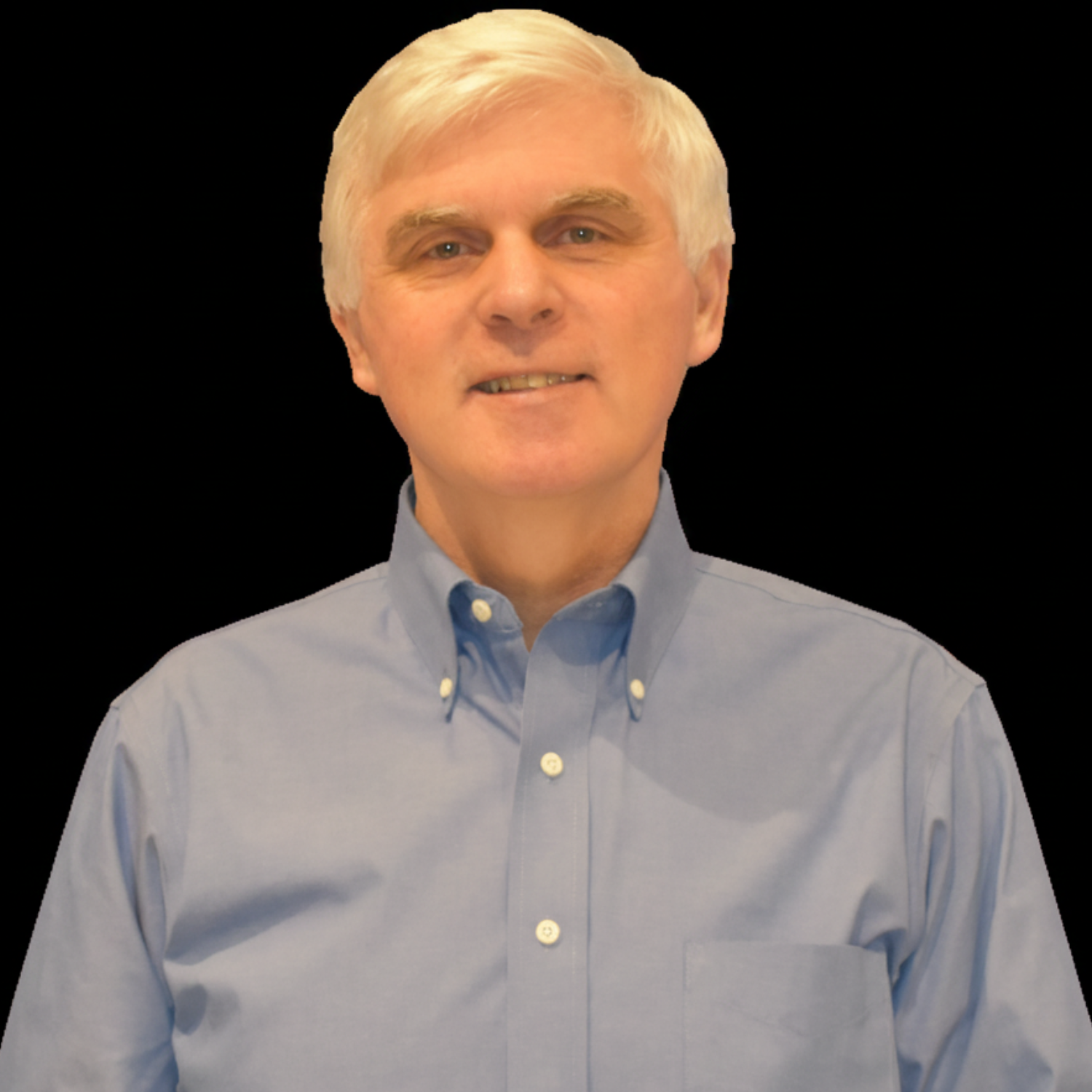 Black and white portrait of a middle-aged man with light-colored, neatly styled hair, wearing a button-down shirt, smiling slightly
