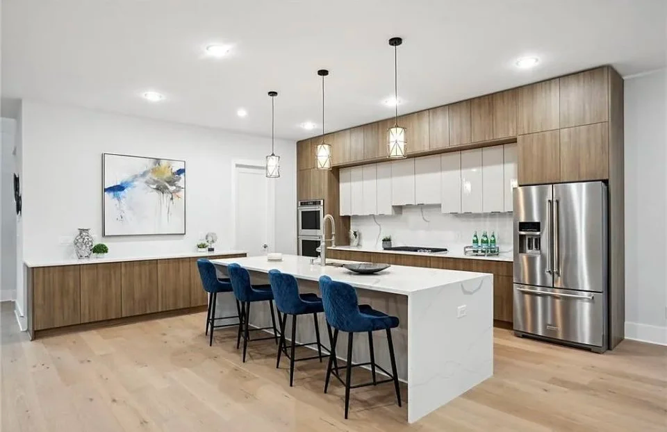 Modern luxury kitchen remodeling in Atlanta with marble countertops and large island