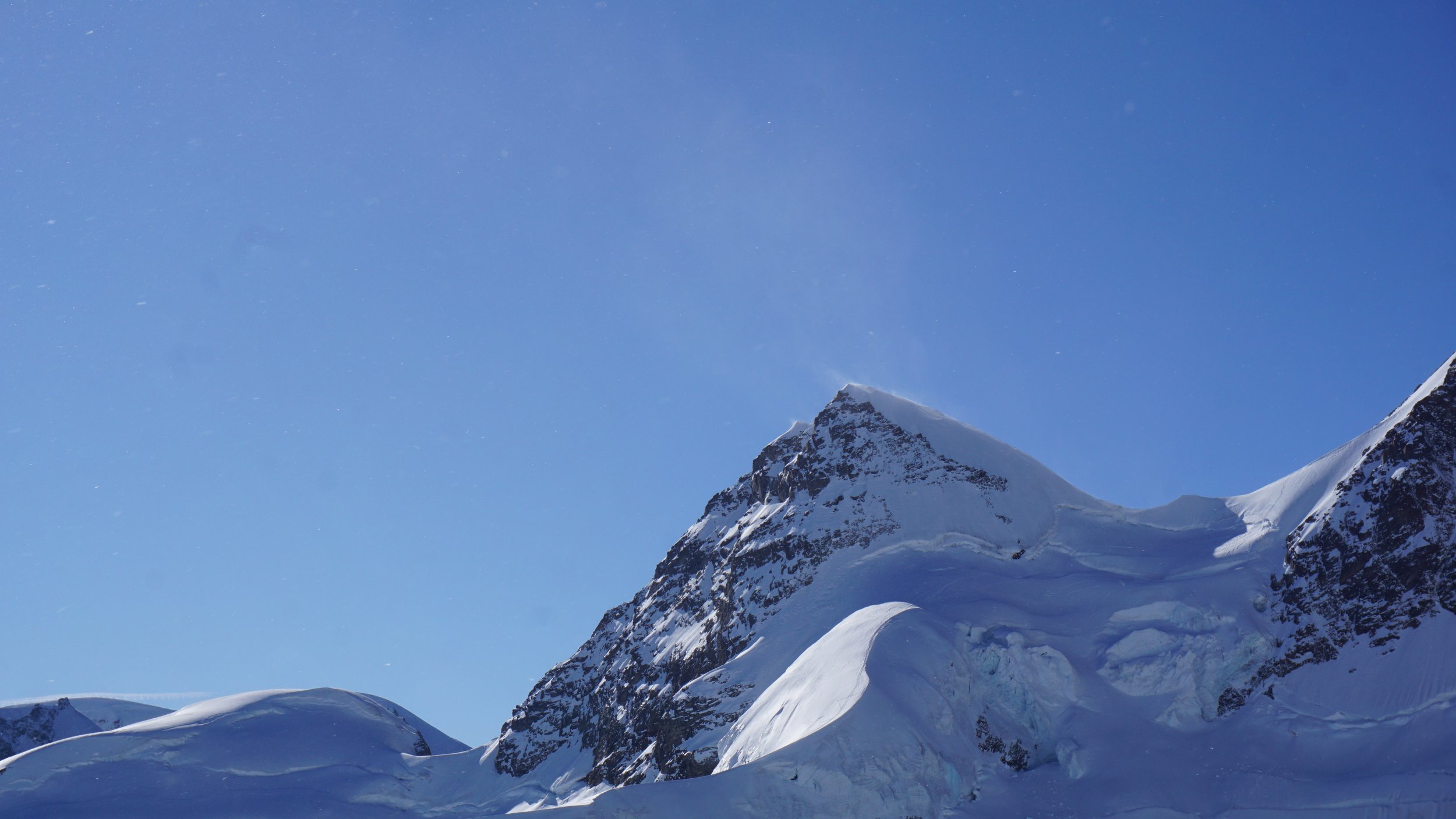 Cinematic 4K aerial videography of a Swiss mountain range showcasing high-end scenic capture for global tourism brands.