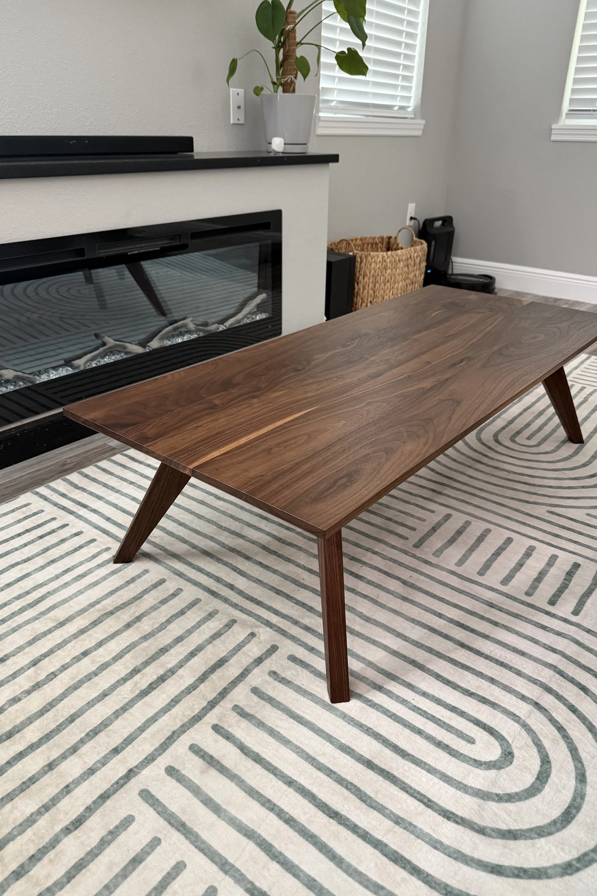 Custom walnut coffee table in a finished living room