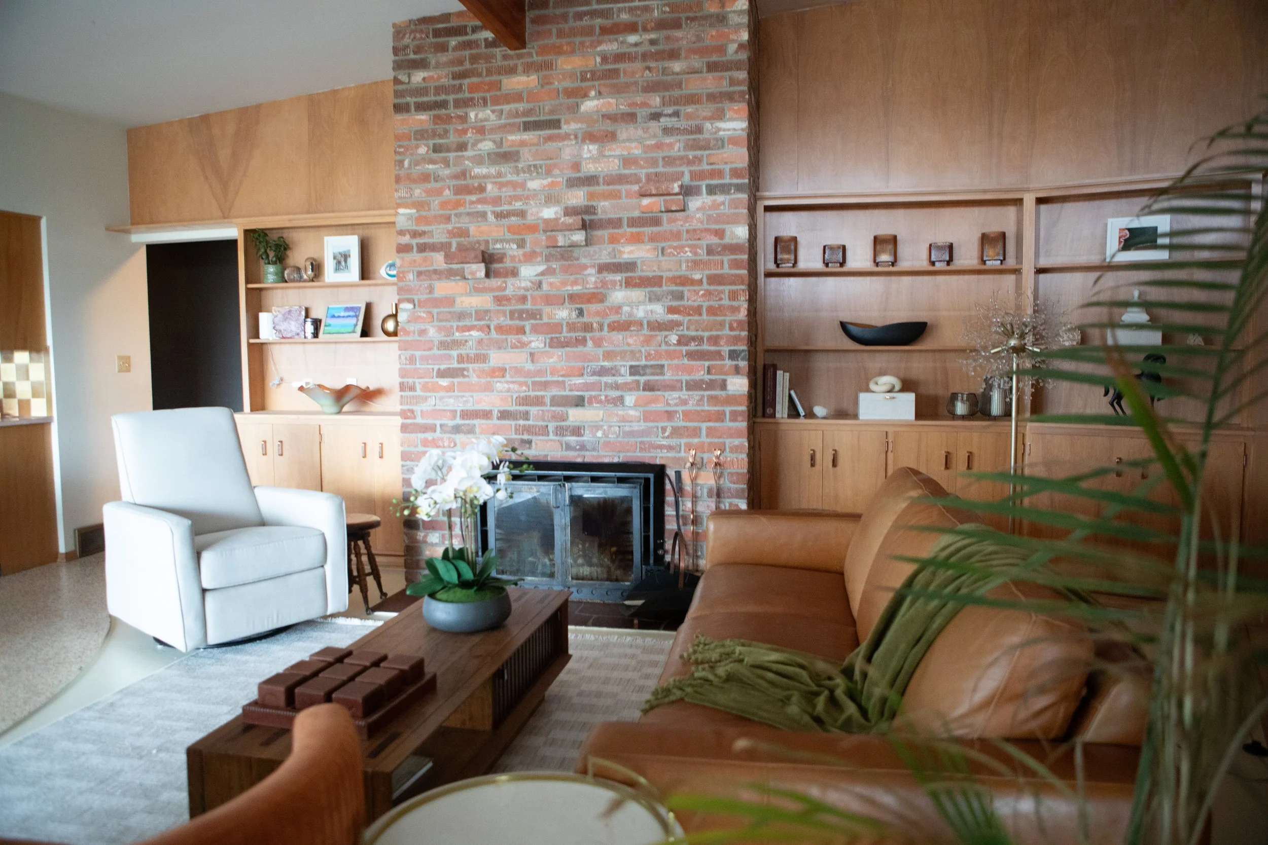 Birch built-in's and a brick fireplace.