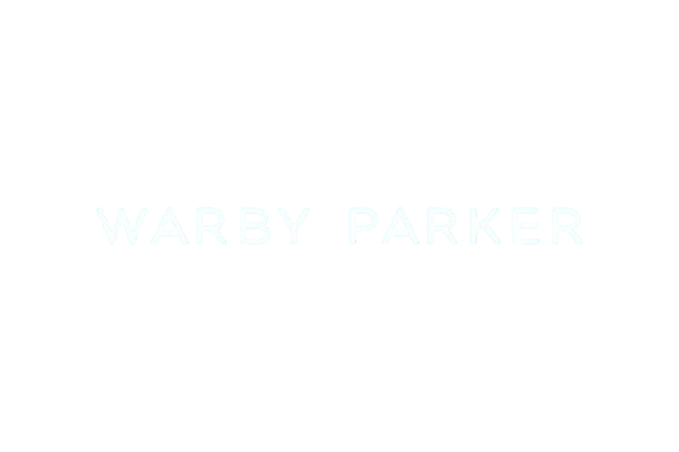 Text on a black background displaying the name "Warby Parker" in light blue letters.