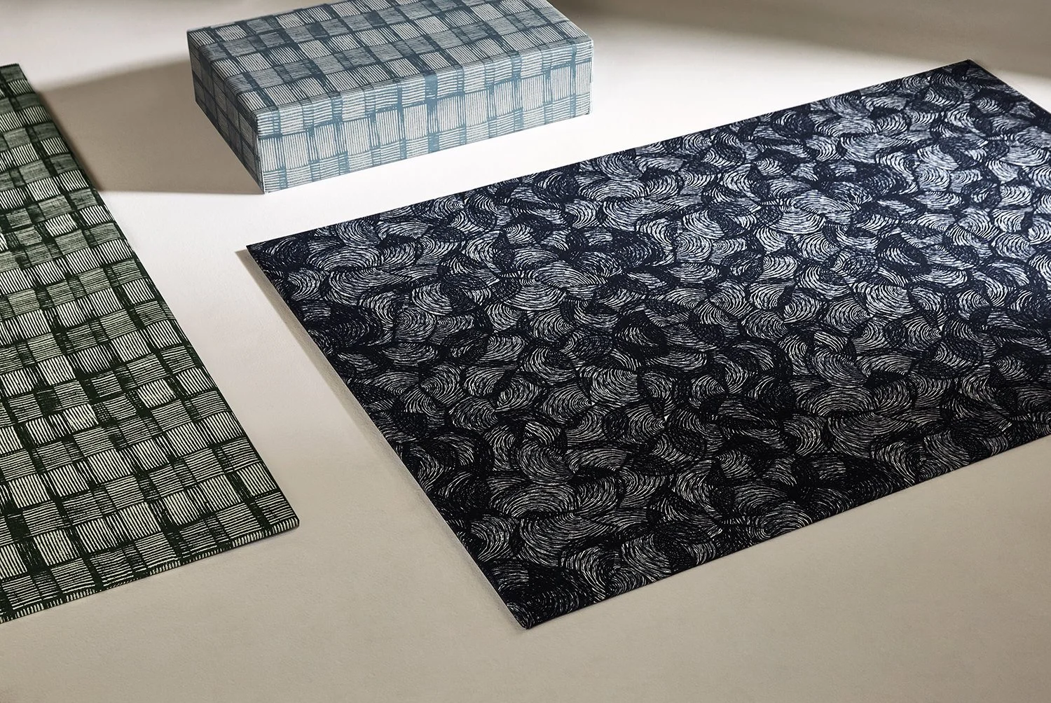 Screens and ottomans upholstered in Willie Weston designs featuring contemporary Aboriginal designs by First Nations artists from the Kimberley, WA.