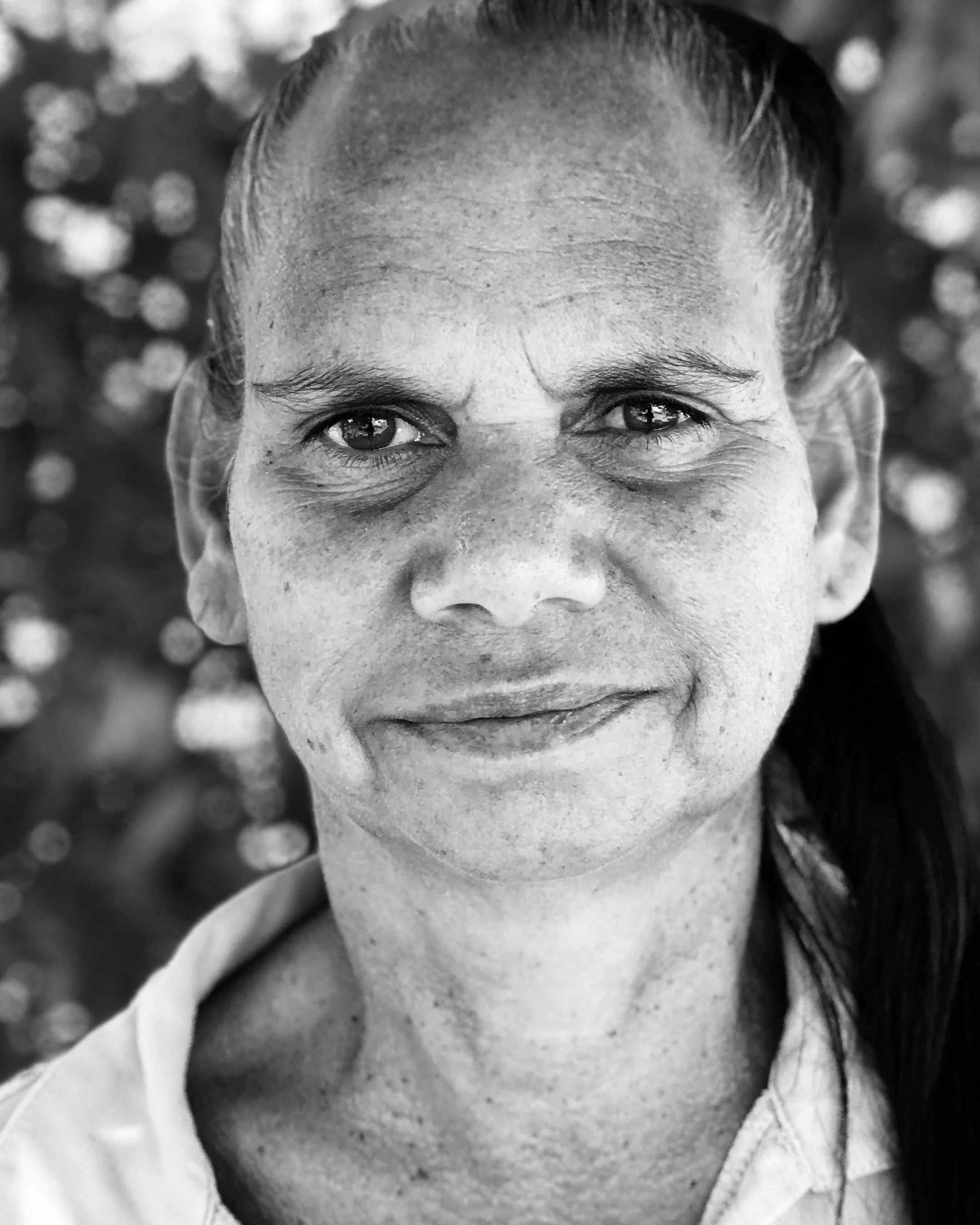Black and white portrait of an Indigenous woman.