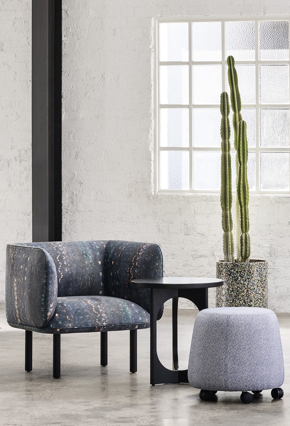 Armchair upholstered in Willie Weston Singing Bush Medicine ‘Night Sky' design, a contemporary floral artwork by First Nations artist Colleen Ngwarraye Morton from Ampilatwatja, NT.