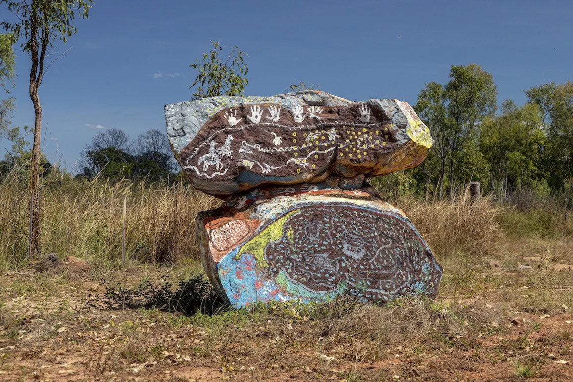 Two large rocks colourfully painted on Country at Peppimenarti, which lies south-west of Darwin.