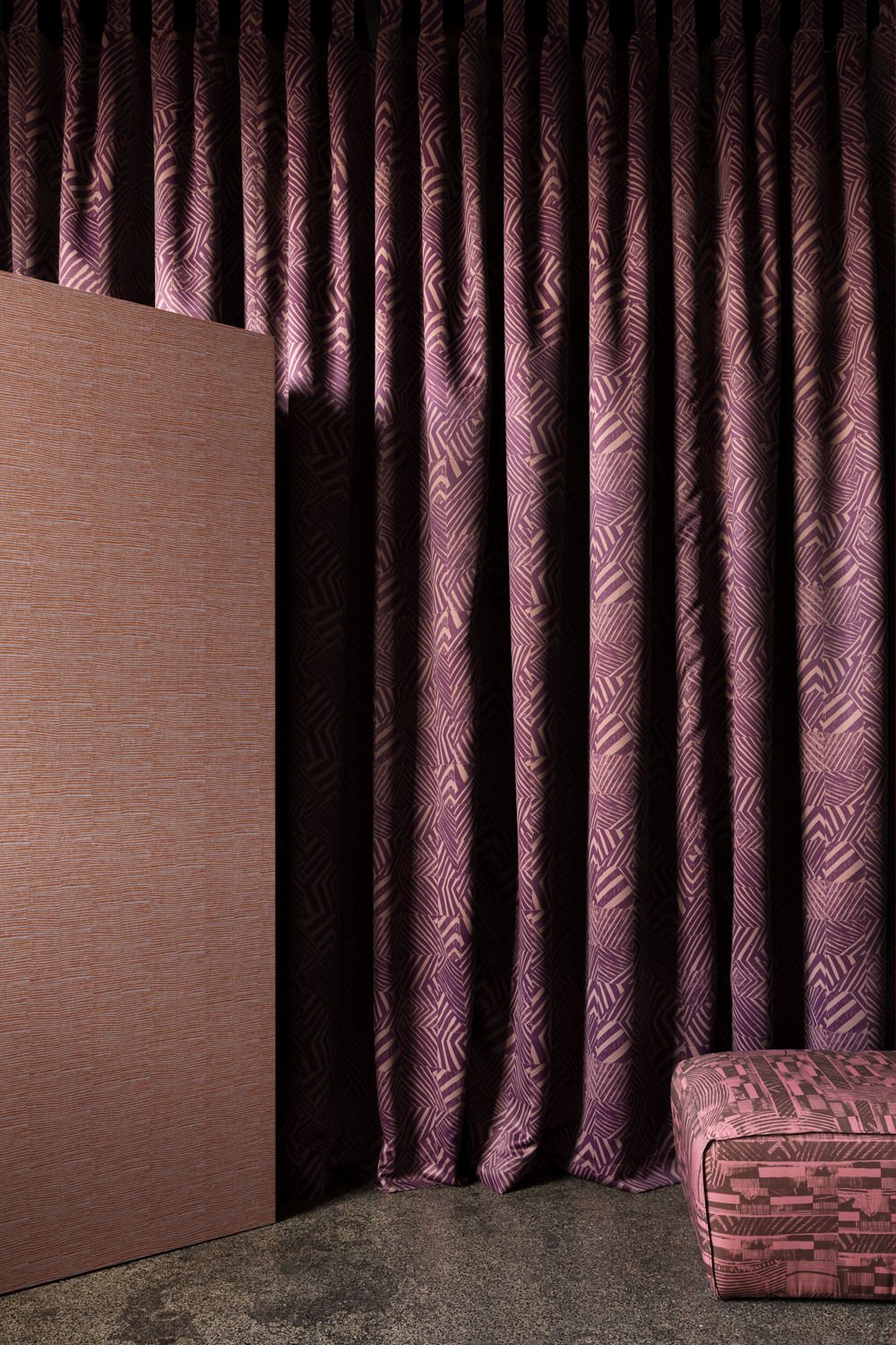 Curtain featuring Willie Weston Defragmentation ‘Mountain Berry' Blockout fabric, a bold geometric artwork by First Nations artist Lisa Waup from Naarm (Melbourne).