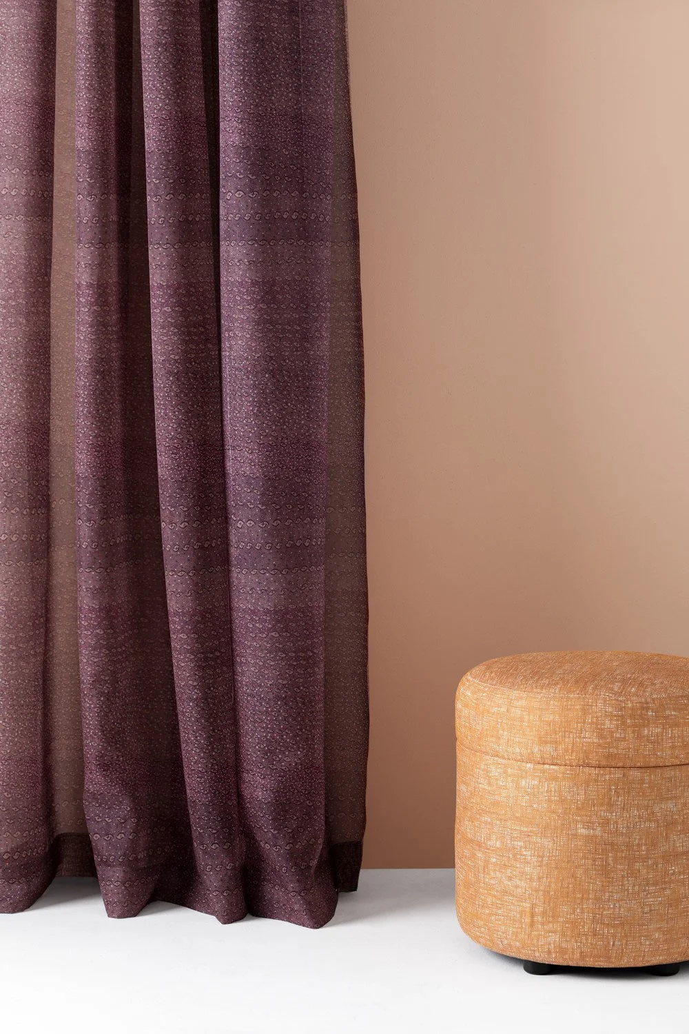 Ottoman upholstered in Willie Weston Syaw (Fish Net) 'Woollybutt' design for upholstery and, a delicately patterned contemporary Aboriginal artwork by Gadigal First Nations artist Kate Constantine.