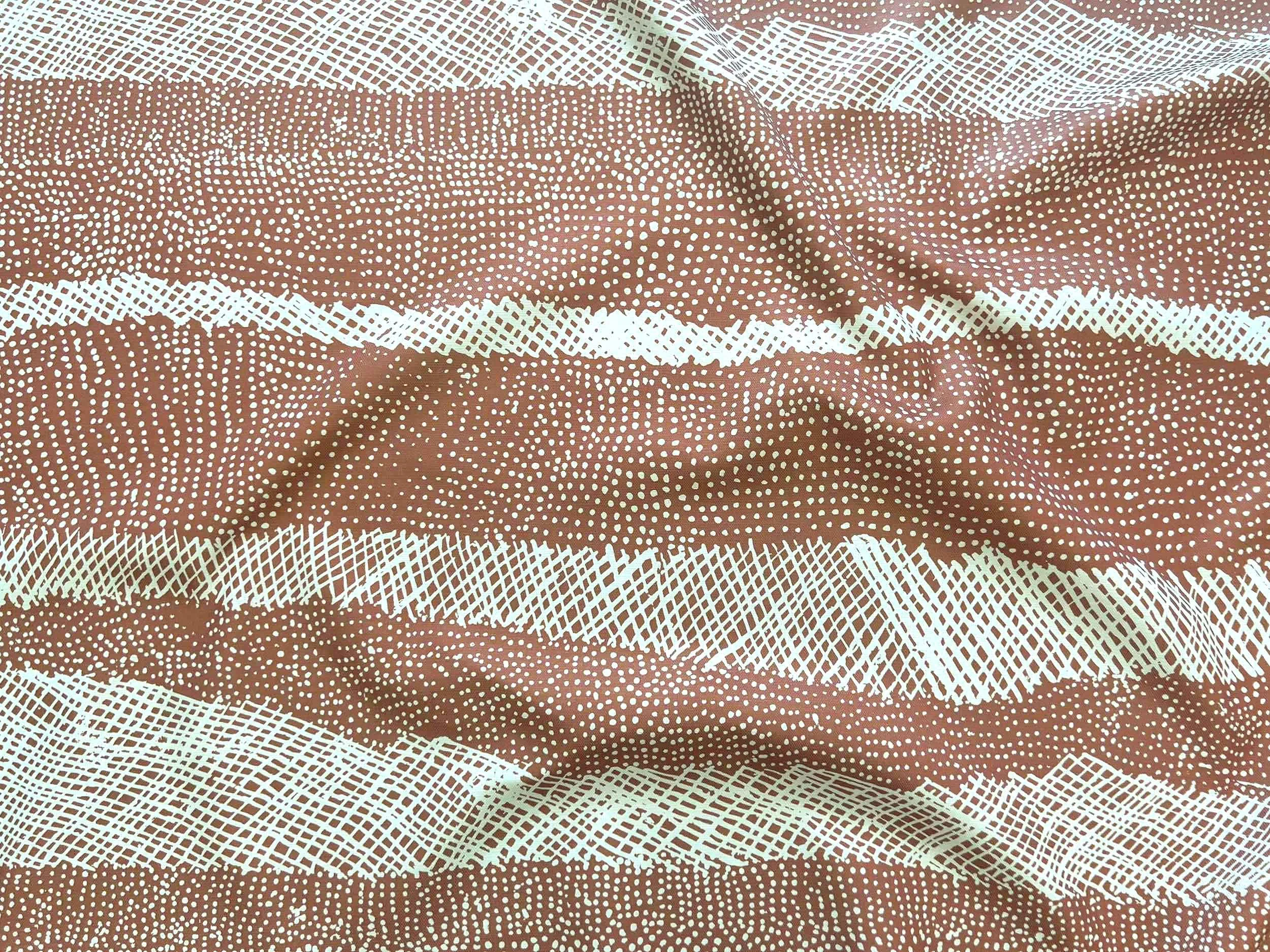 Willie Weston Jilamara 'Baked Clay' design for upholstery, featuring dotted and cross-hatched contemporary Aboriginal artwork by Tiwi First Nations artist Jean Baptiste Apuatimi.
