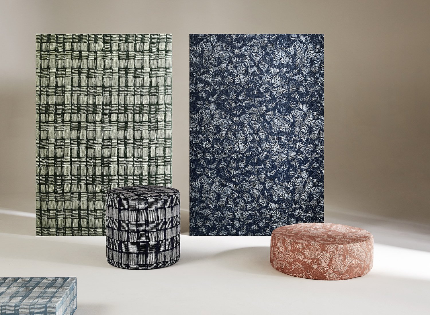 Screens and ottomans upholstered in Willie Weston designs featuring contemporary Aboriginal designs by First Nations artists from the Kimberley, WA.