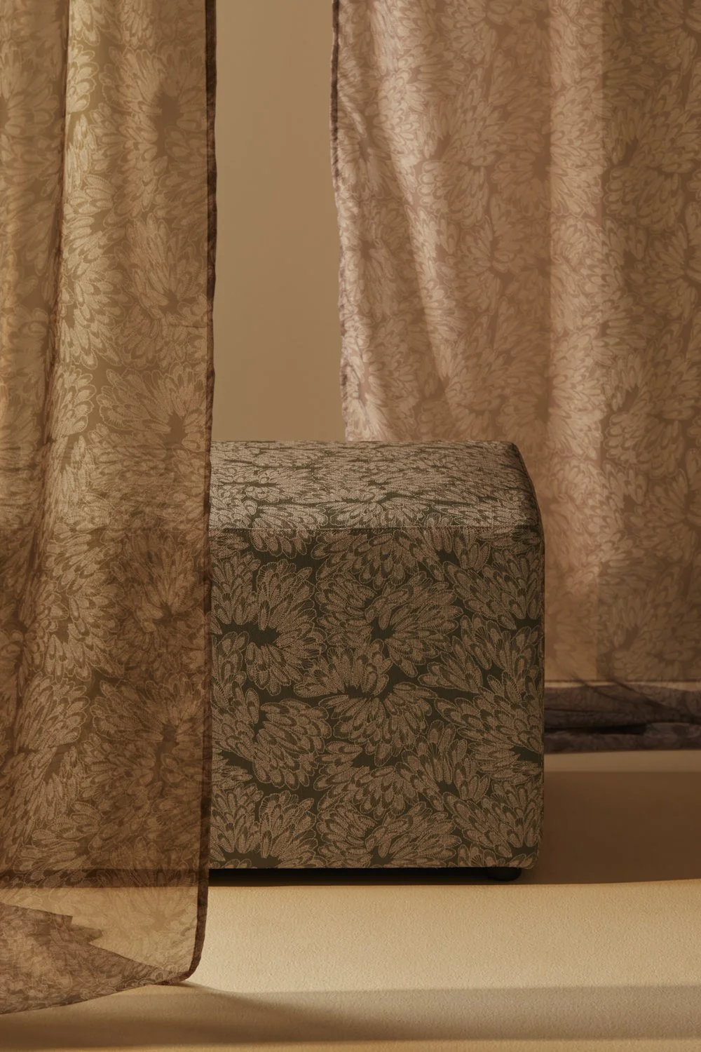 Ottoman upholstered in Willie Weston Dyin Bangada: Ngunyul (Gadi (grass tree') design, a delicately patterned contemporary Aboriginal artwork by Gadigal First Nations artist Kate Constantine.