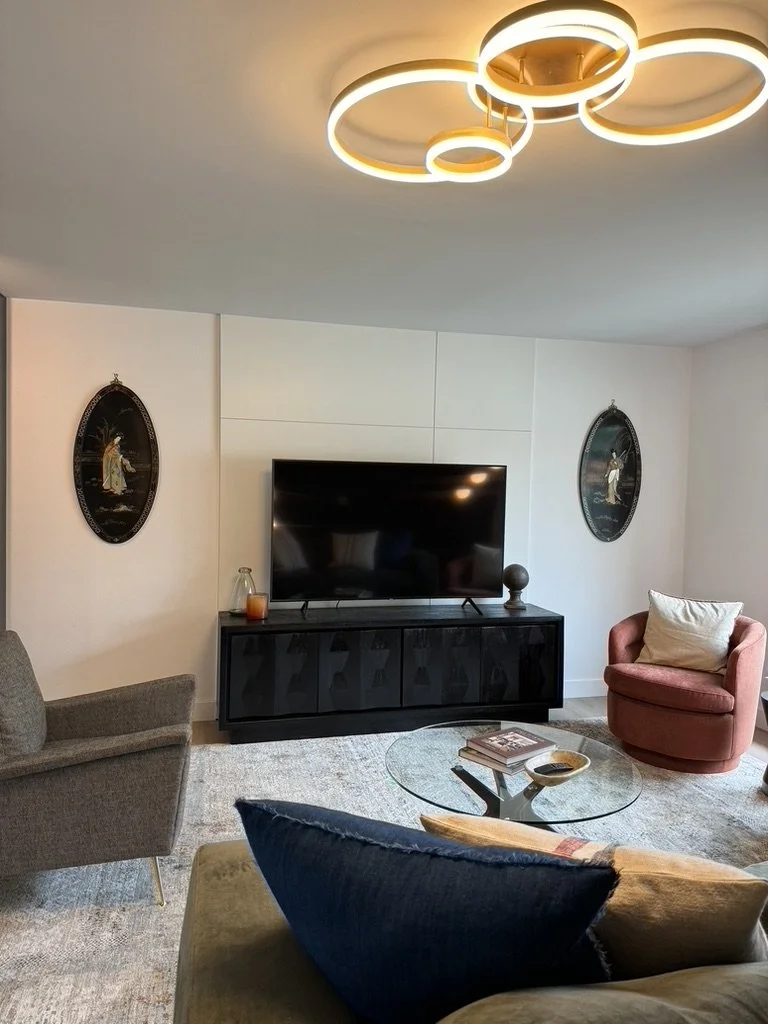 The simple lines in the wall detail draws your eye to texture and adds interest behind the TV.