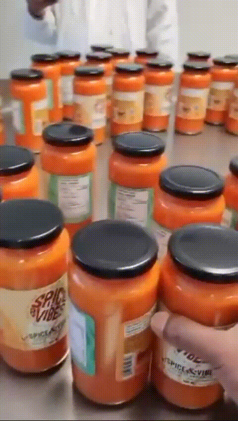 Freshly prepared jars of authentic Nigerian pepper sauce lined up and ready for sale