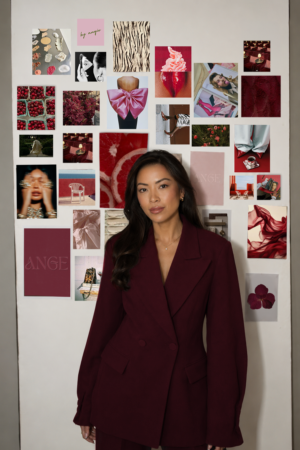 Angie Liu is wearing a burgundy blazer and standing in front of a collage of images on a white wall. The collage includes pink, red, and neutral-toned photos of flowers, fabric, fashion, and abstract art.