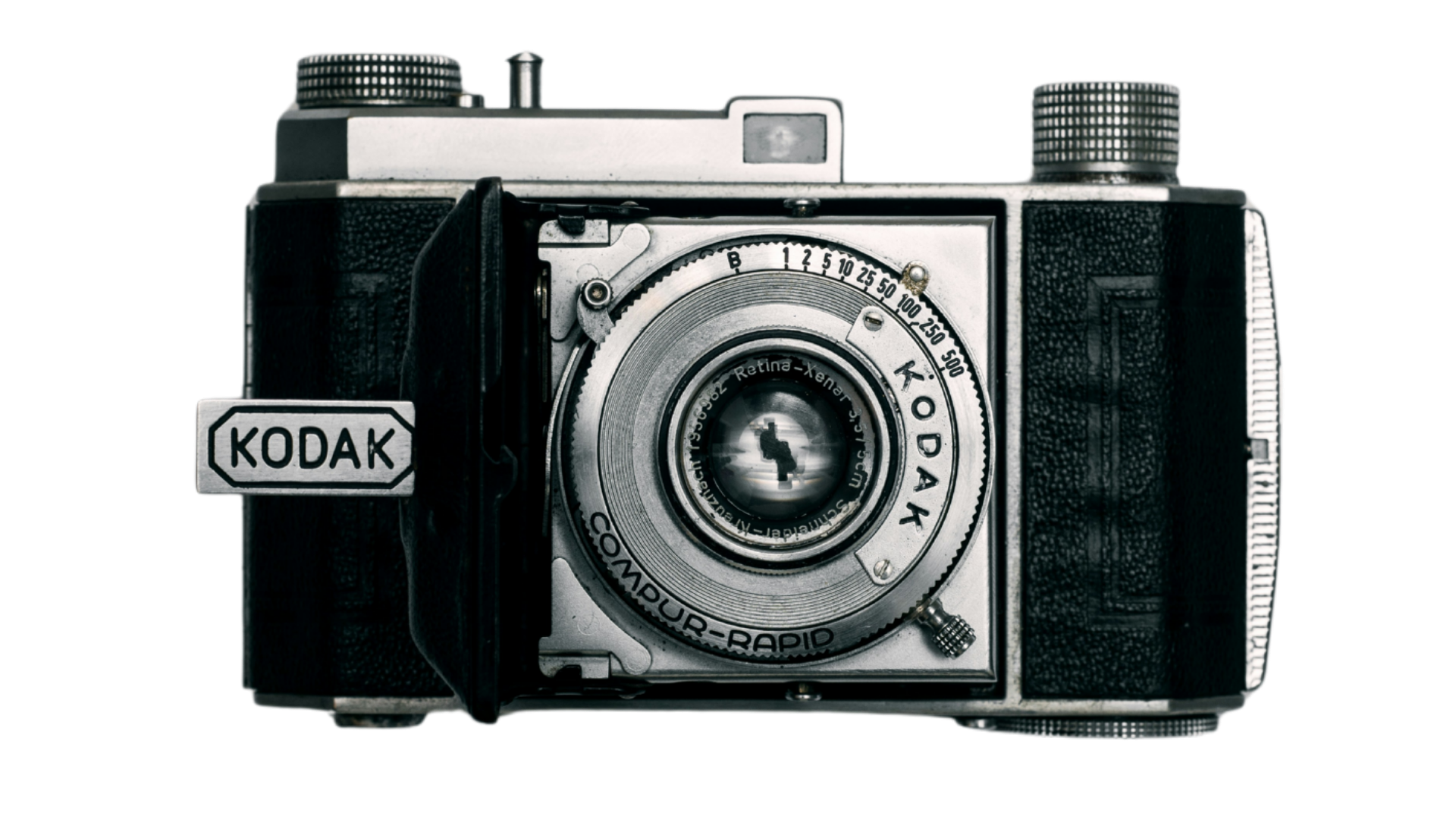 A vintage Kodak camera with a metal lens and a black textured body.