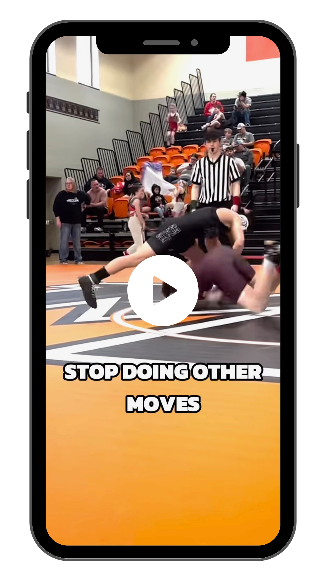 Viral Client Video: A wrestling match in a gymnasium with spectators watching, including children and adults, and a referee standing nearby. The text on the screen reads, "STOP DOING OTHER MOVES." and a play button icon on a mobile device screen.