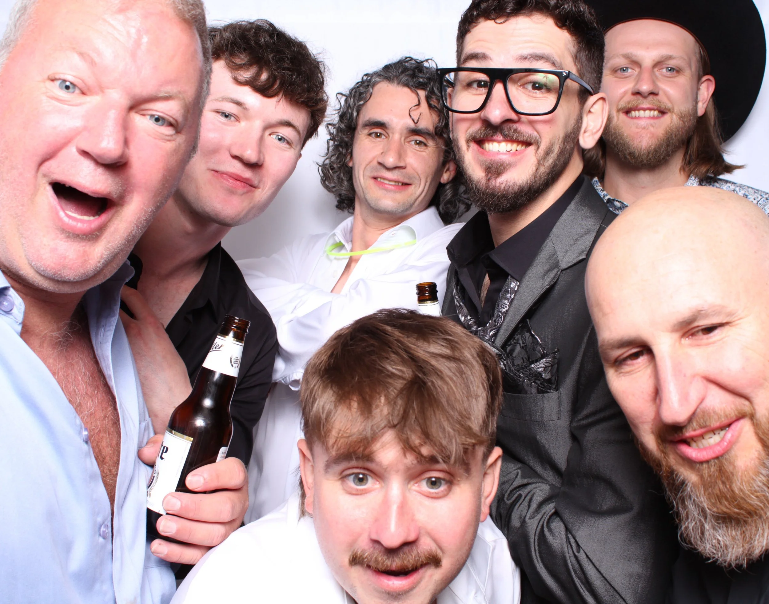 The groom and his friends taking a boys pic at his toronto wedding photobooth