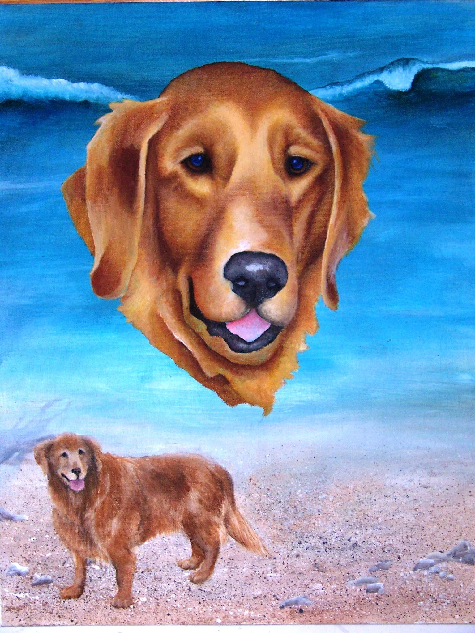 Painting of a large golden retriever's head floating above a sandy beach with a smaller, real golden retriever standing on the beach, with ocean waves in the background.