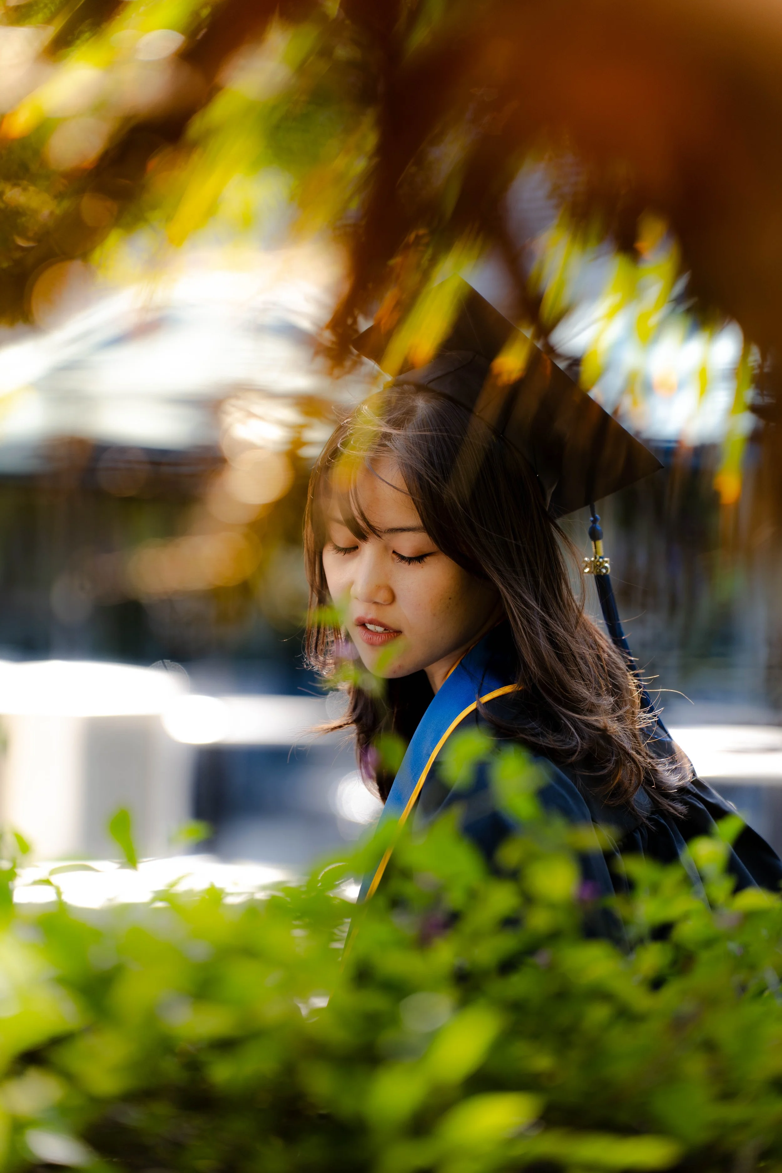 San Jose State University Natural light graduation portrait of a student captured candidly during a Bay Area graduation session, photographed by Lei Photography Collective.