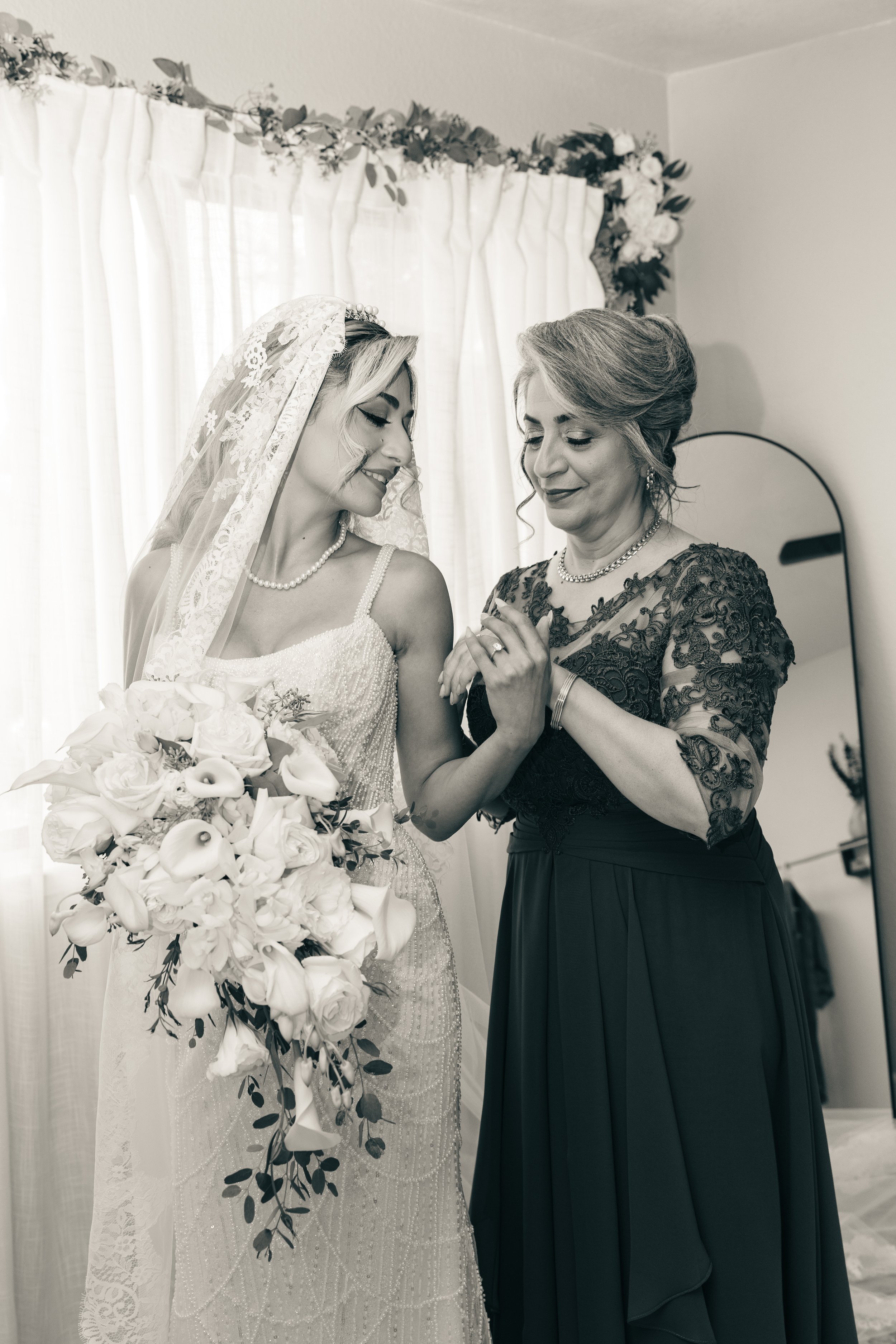 Bride sharing an emotional moment with her mother during wedding preparations, captured in black and white at a Bay Area wedding by Lei Photography Collective.