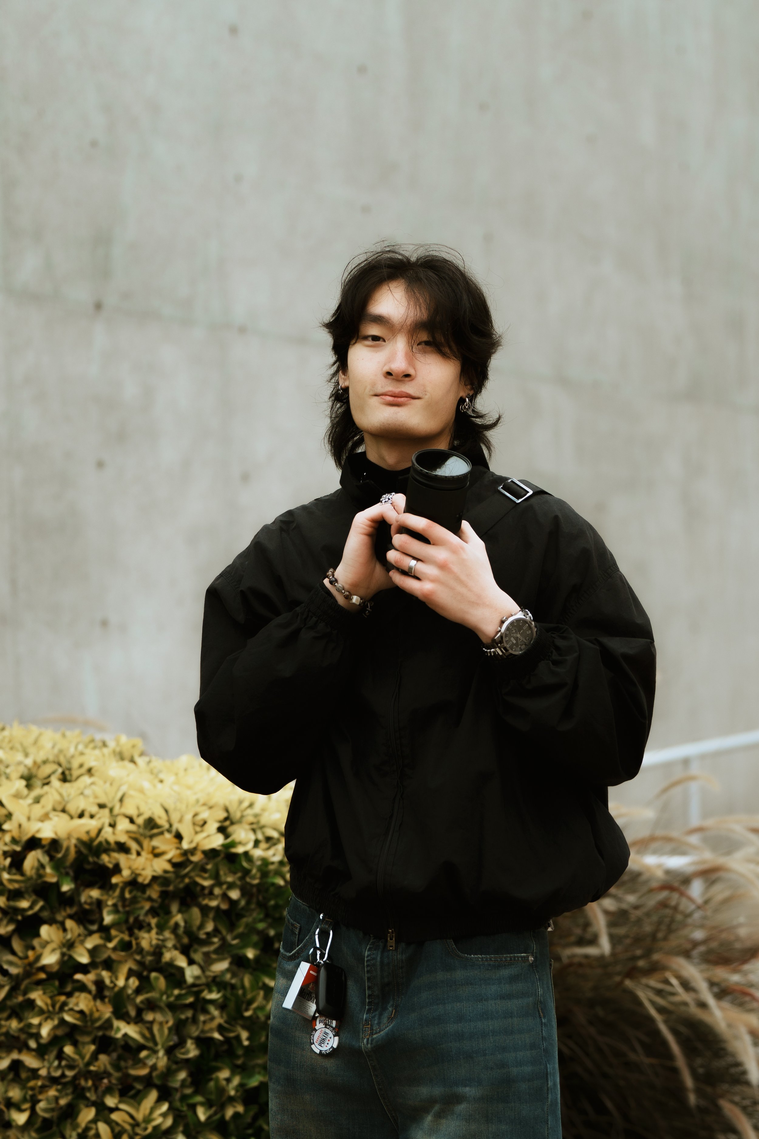 Portrait of Raymond Lei, freelance photographer and founder of Lei Photography Collective, photographed in natural light.