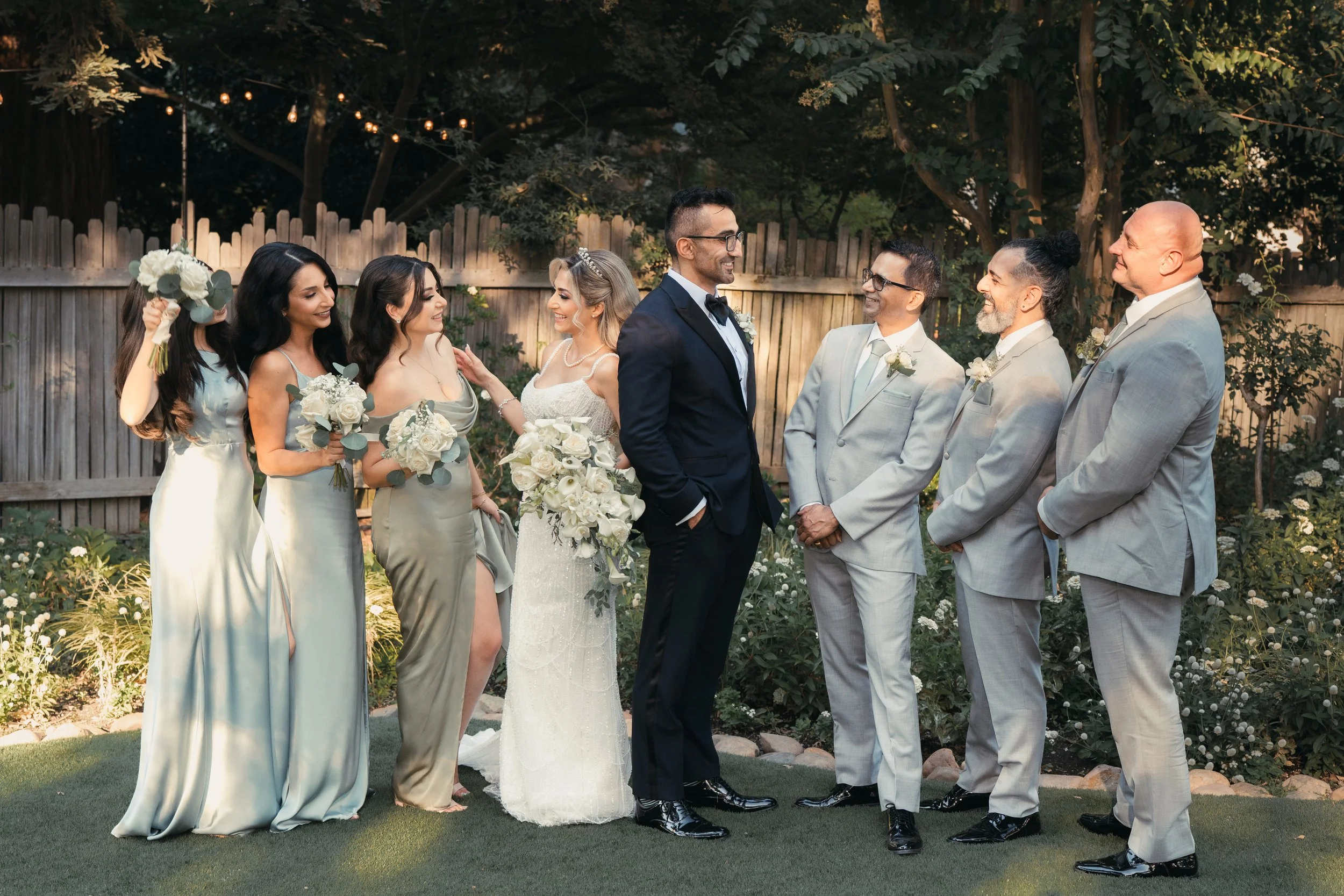 Candid wedding party portrait captured in natural light during a Bay Area wedding, featuring the bride, groom, bridesmaids, and groomsmen, photographed by Lei Photography Collective.