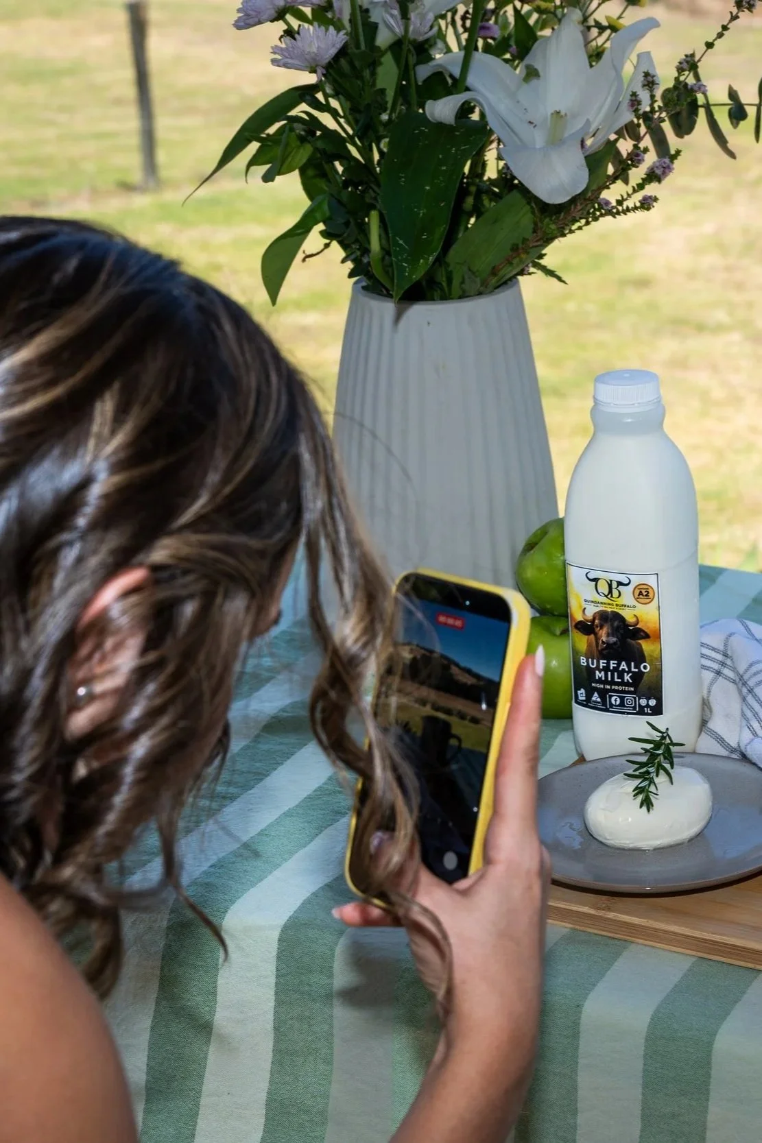 A woman holding a phone