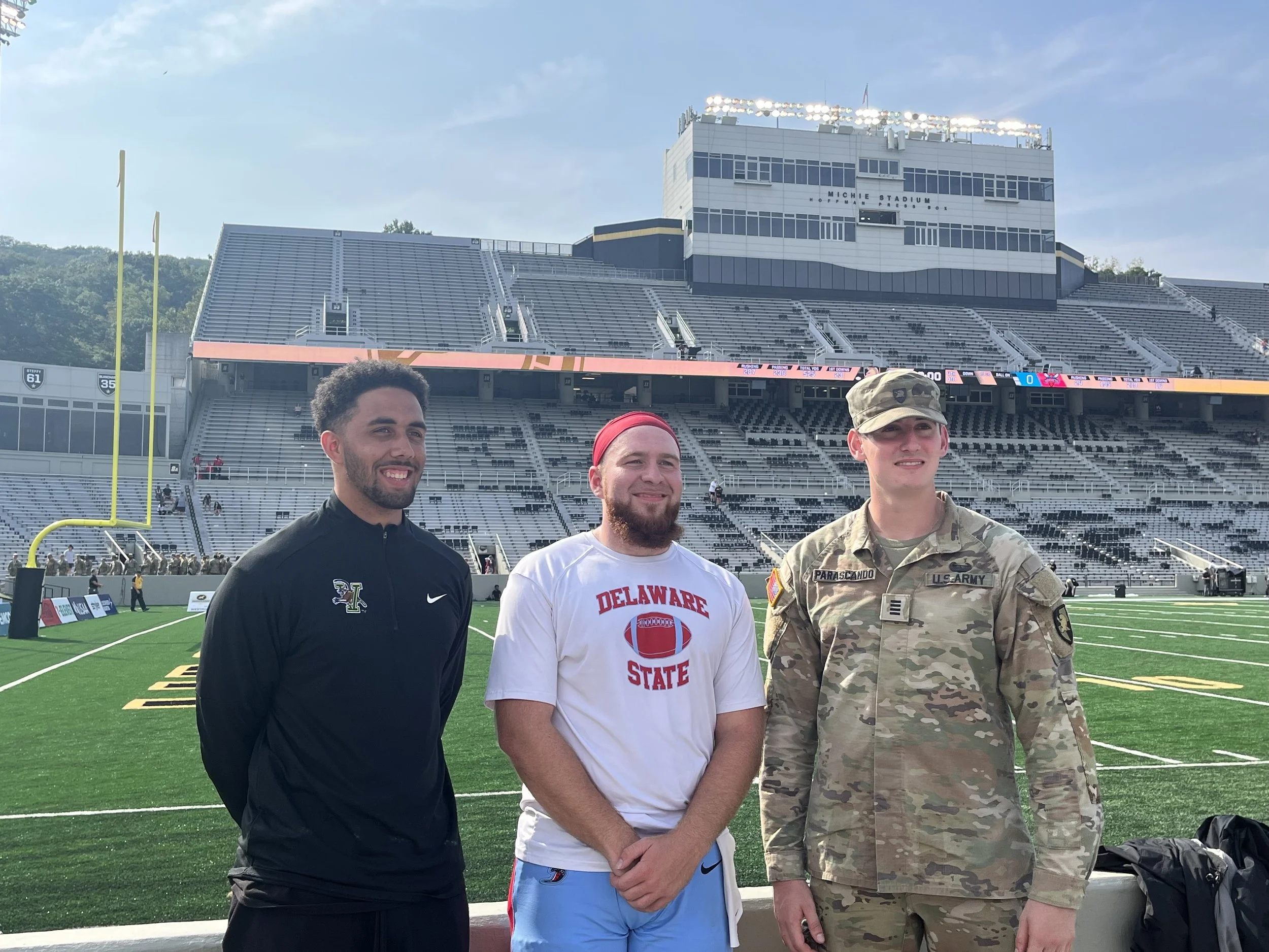 Javen Sears alongside Michel Bergeron and Lucas Parascando at West Point during the Delaware State University vs. Army football game in 2023.