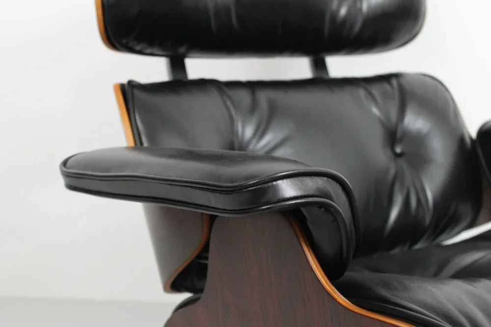 Restored Eames chair with new black leather