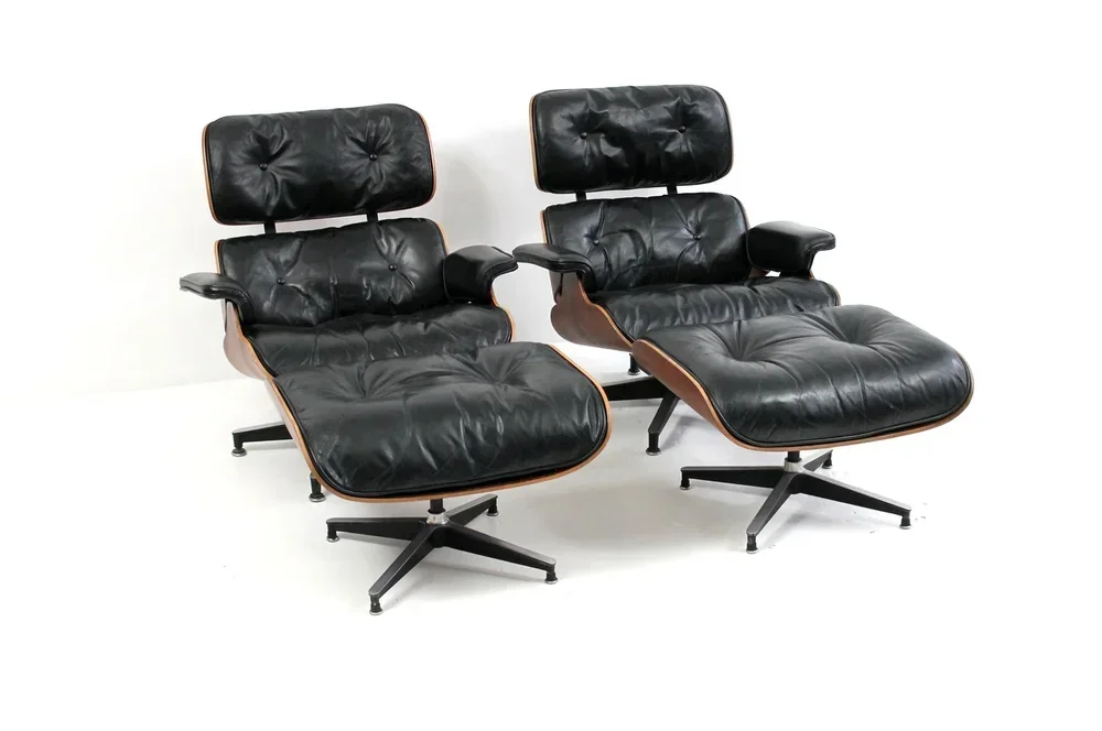 Restored black Eames lounge chairs