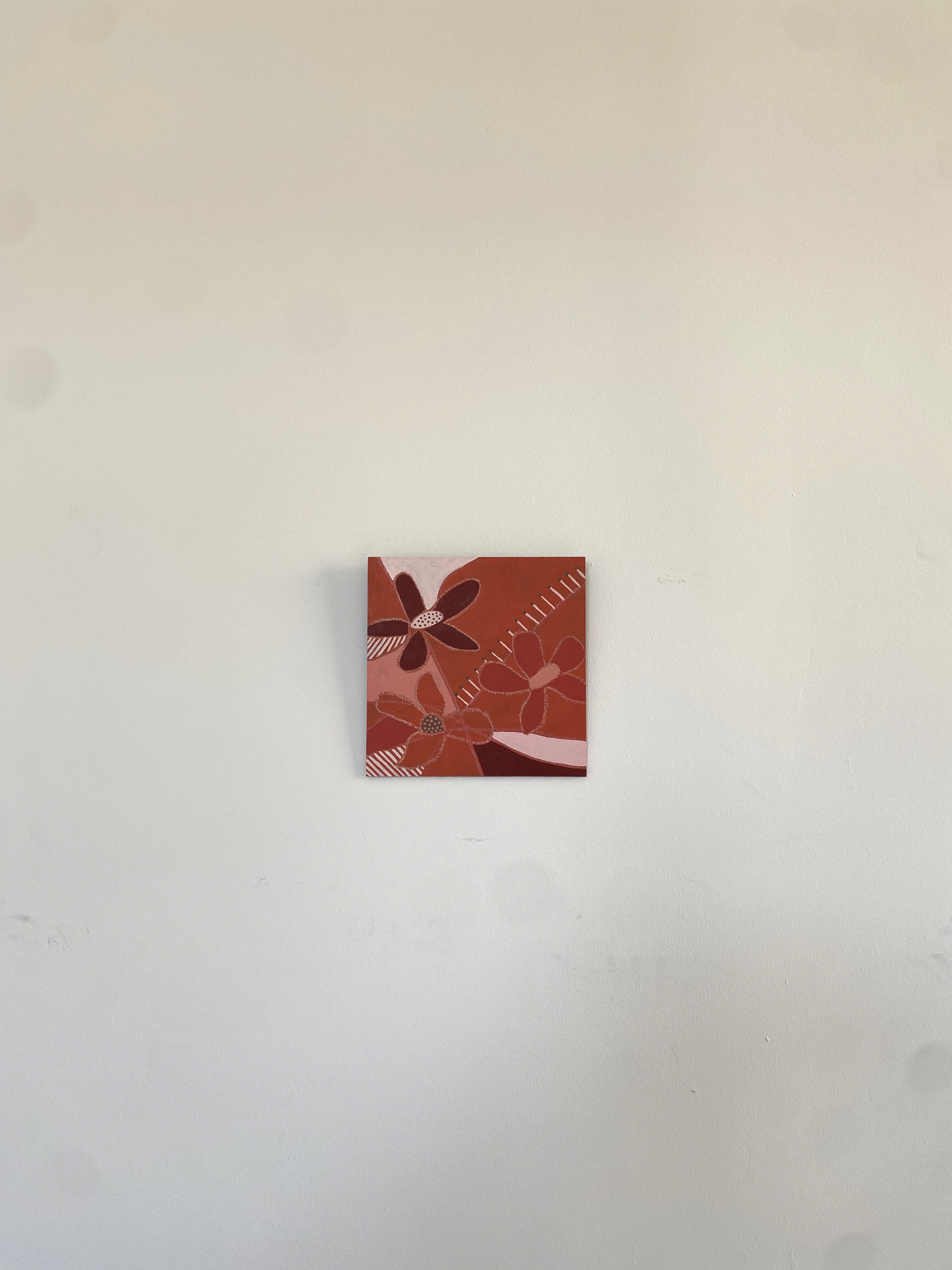 wall flower orange pink hawaii - on wall.png