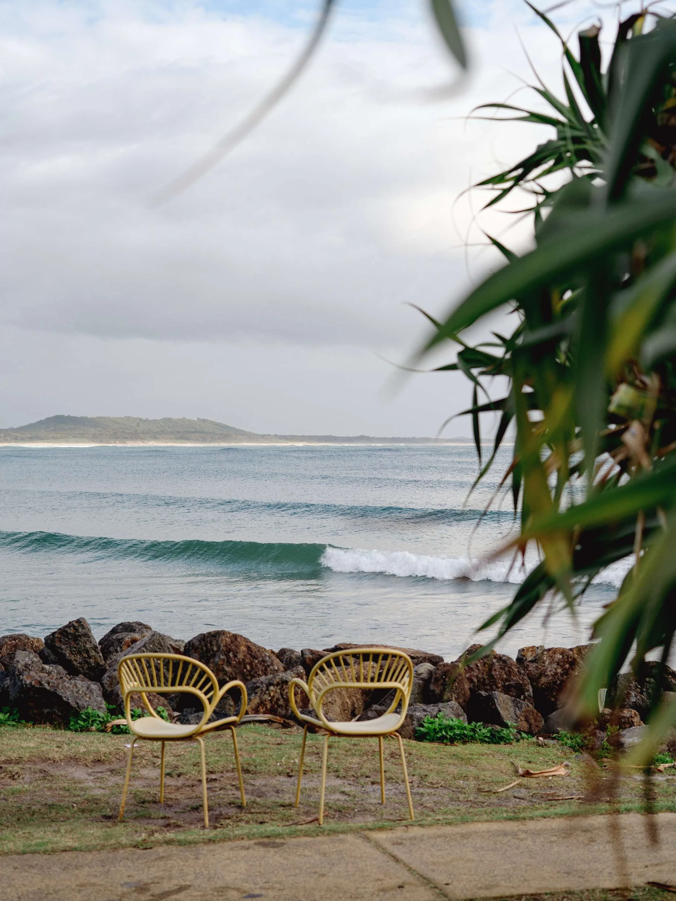 coastal photo of Crescent Head beach with surfers
