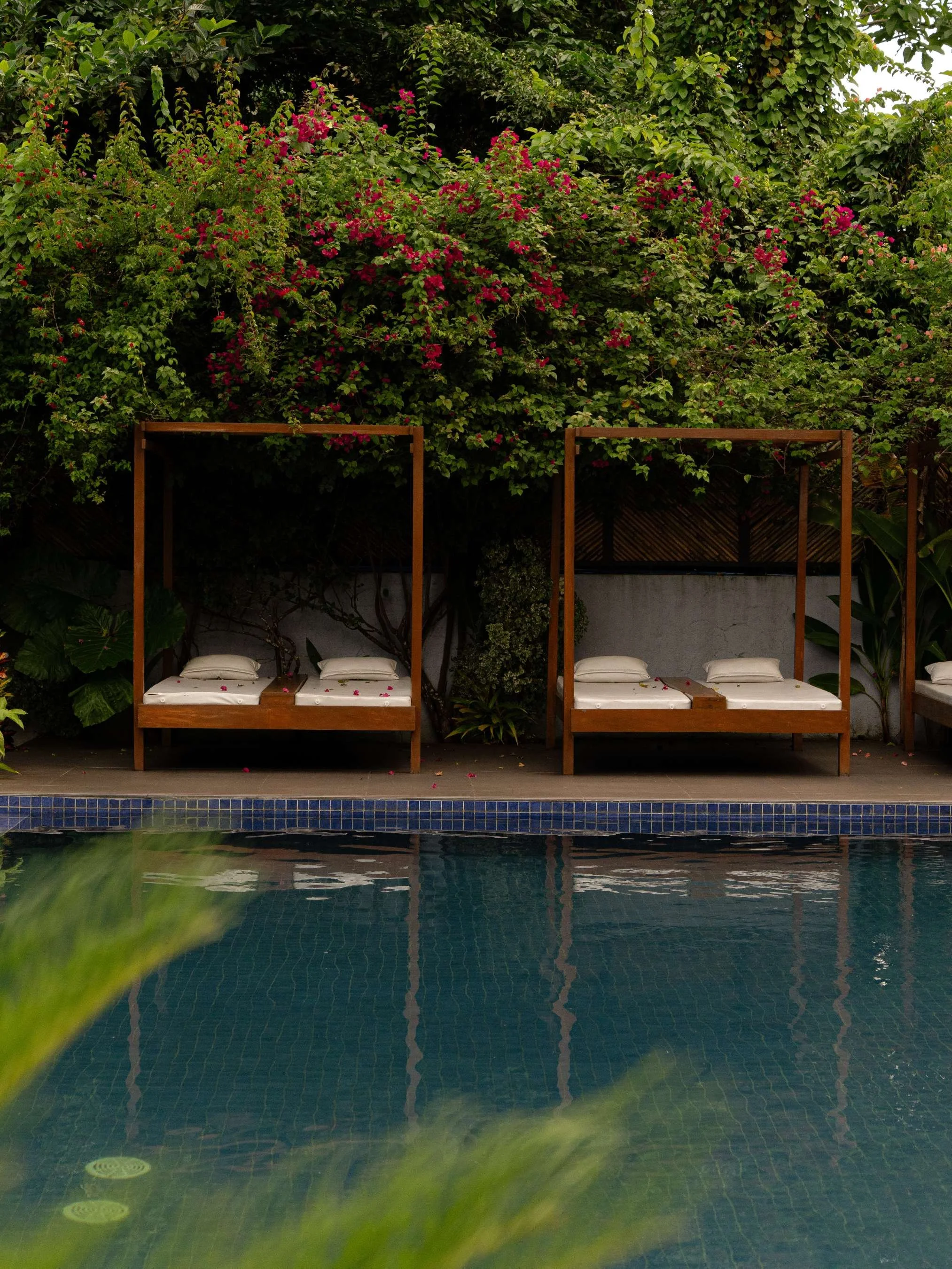 Poolside view with two wooden cabana, hotel photography at Anistar Resort in El Nido, Philippines 