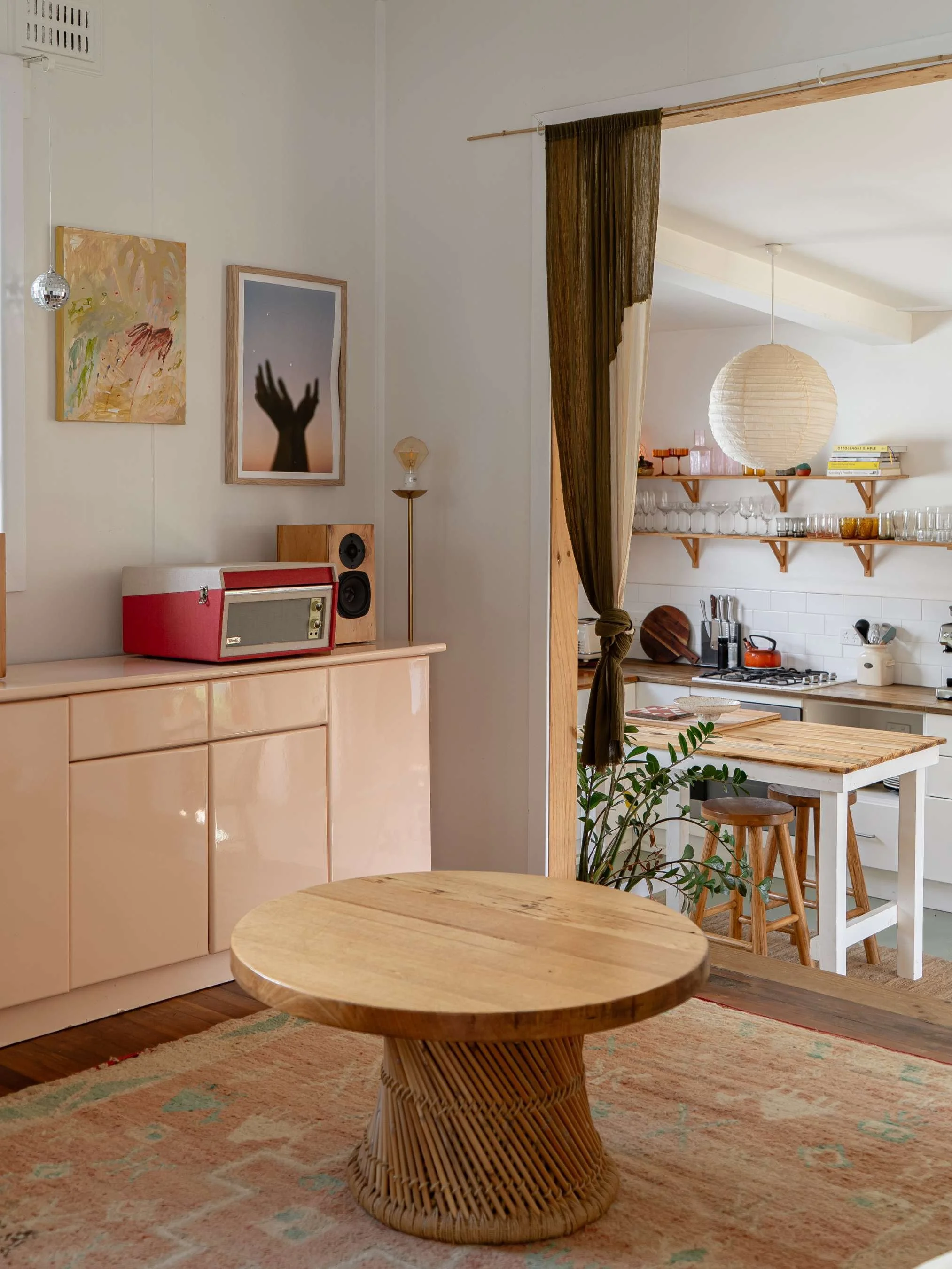 A cozy living space with retro interior photography and a record player at Crescent Head, NSW, Australia, the Airbnb is called the Surf Shack. A photo of the 70's living room 
