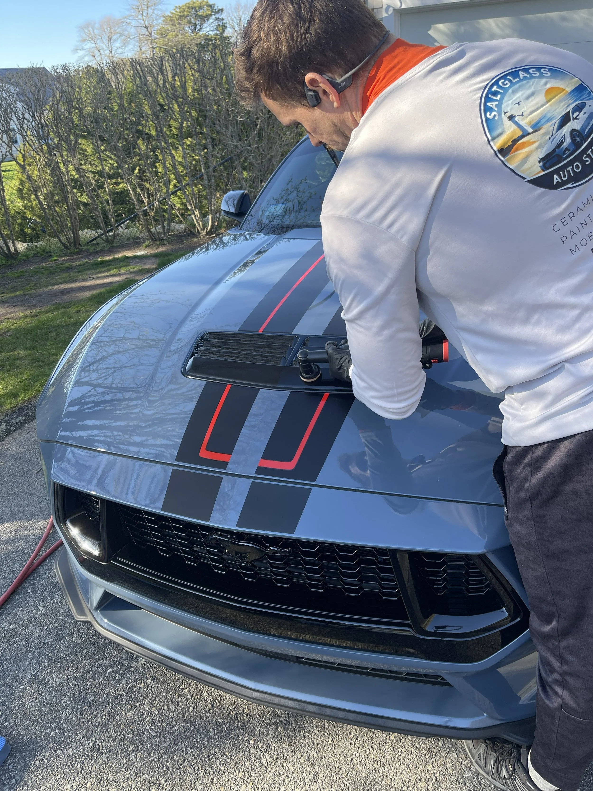 Saltglass Auto Studio polishing the surface of a Mustang 5.0 in Chatham before doing prepwork for the ceramic coating installation.