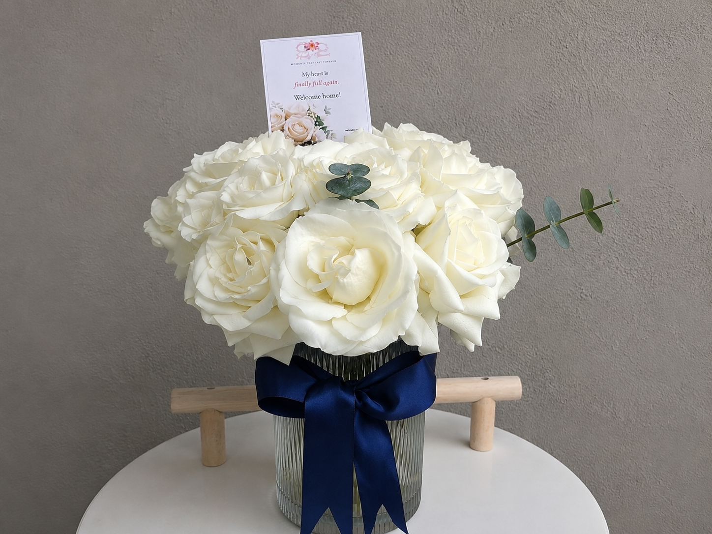 Classic White Rose Arrangement with 12 white roses, eucalyptus, and satin ribbon