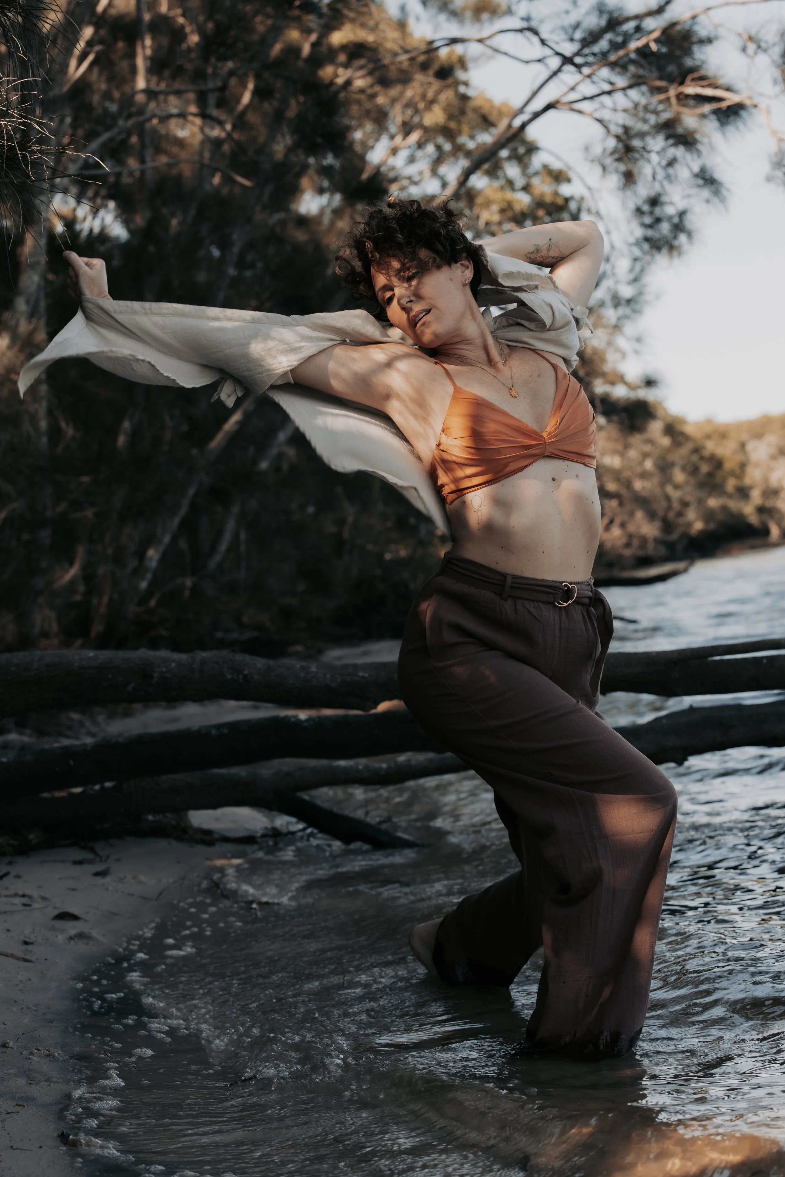 woman moving with shirt in the wind