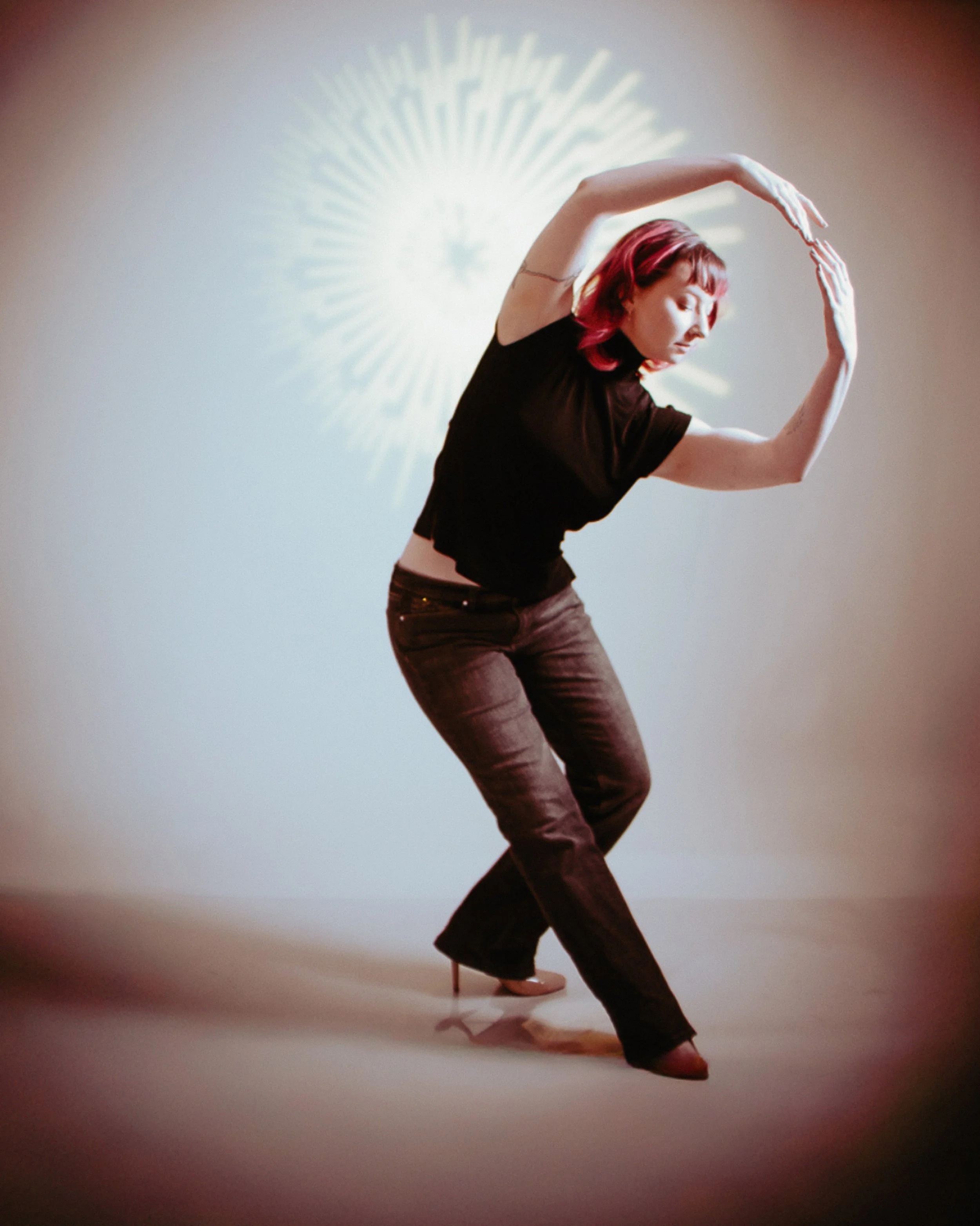 Creative fashion portrait featuring expressive movement and editorial styling during a ScottyD TFP collaboration in Dayton, Ohio.