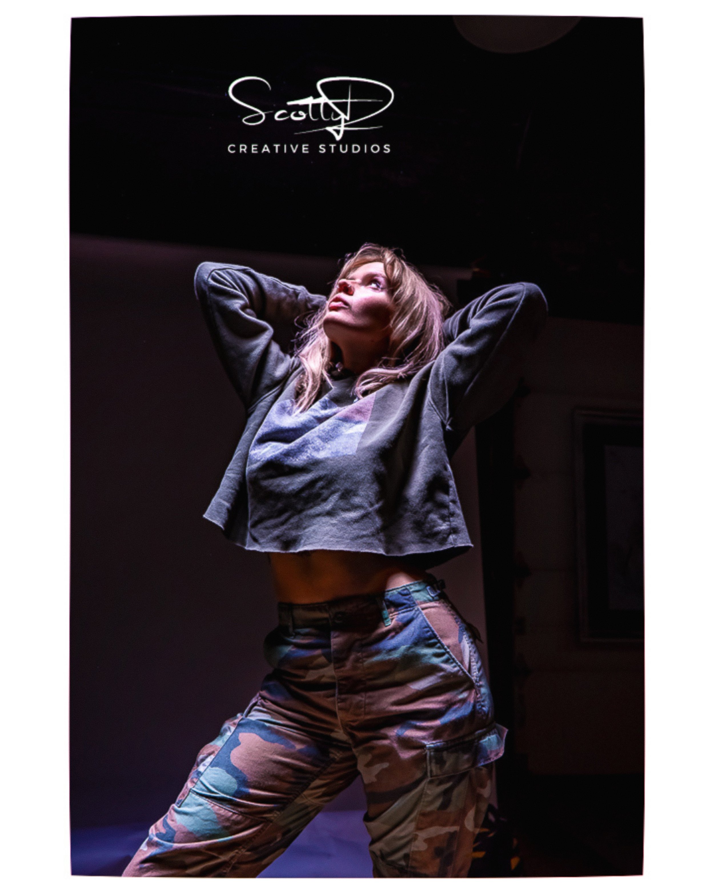 Creative fashion portrait featuring expressive movement and editorial styling during a ScottyD TFP collaboration in Dayton, Ohio.