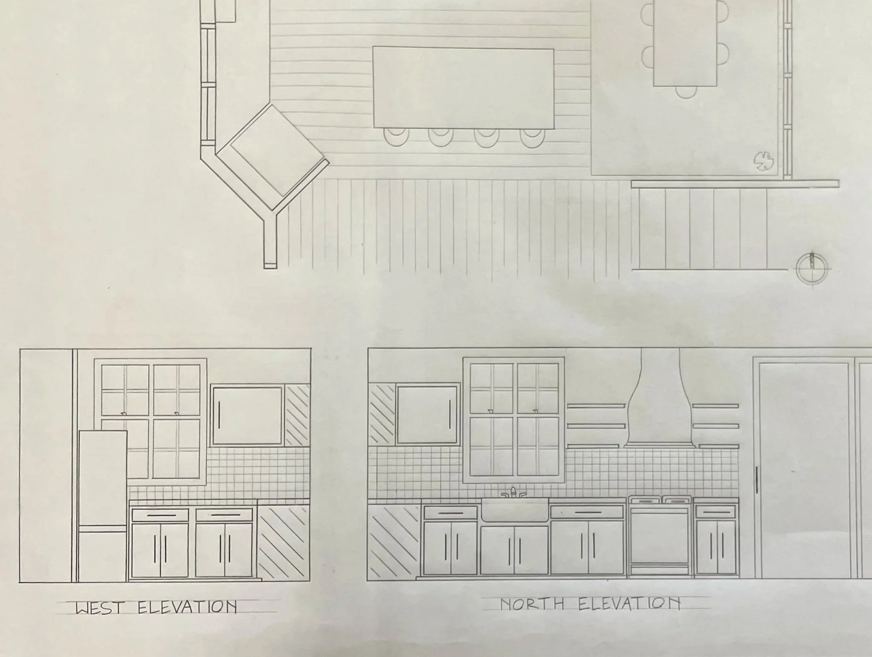 Architectural blueprint showing a top view of a house's floor plan and elevation drawings for west and north walls, including windows, doors, kitchen cabinets, and furniture layout.
