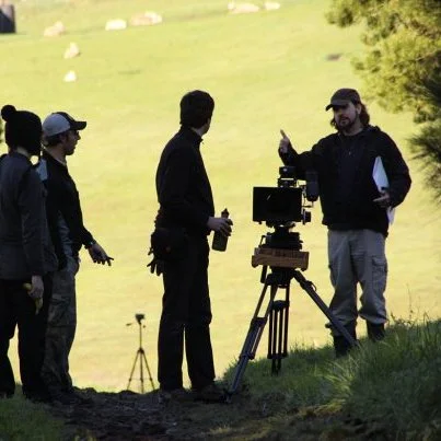 Film crew on set of a movie shooting, led by director Jerry Rapp