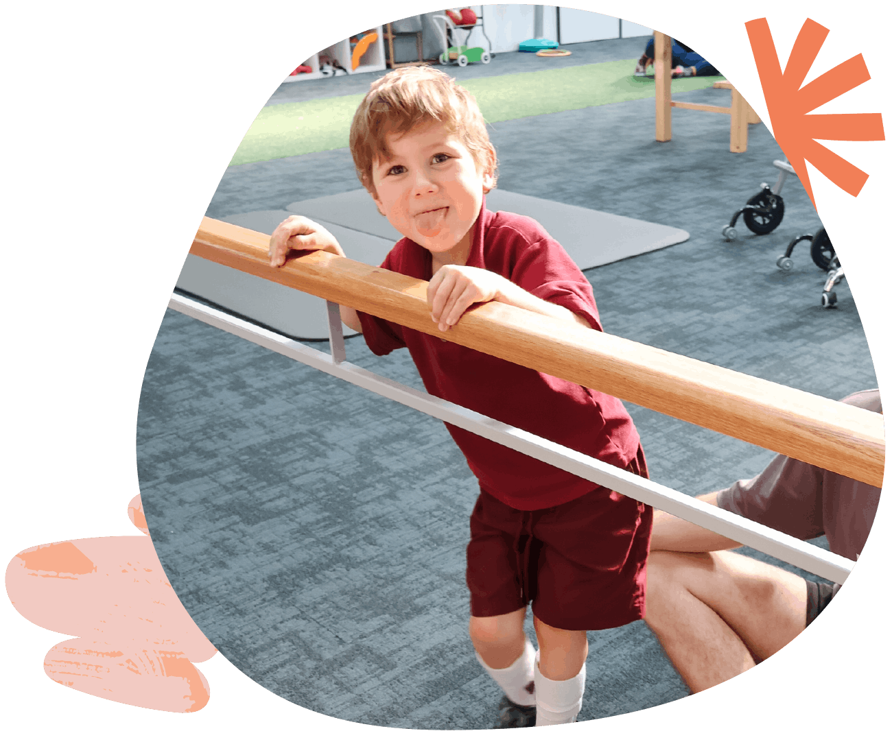 Child and exercise physiologist engaging in a balance and coordination game during a session