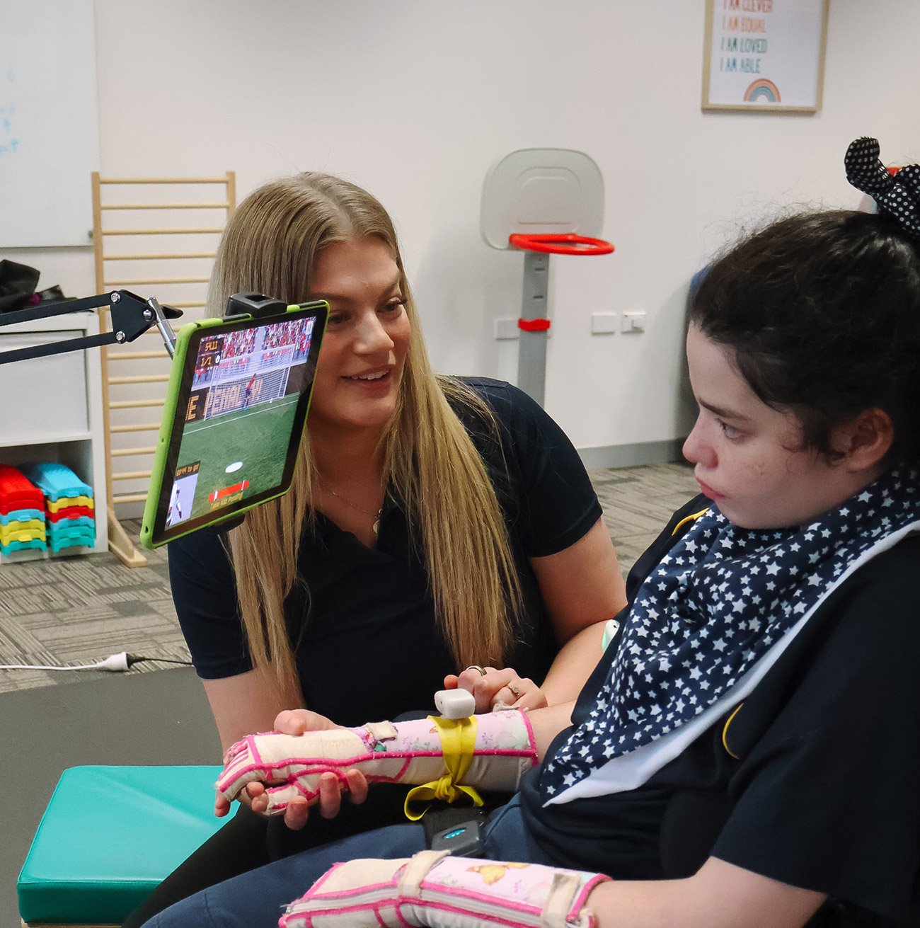 Clinician trialing assistive technology with a client