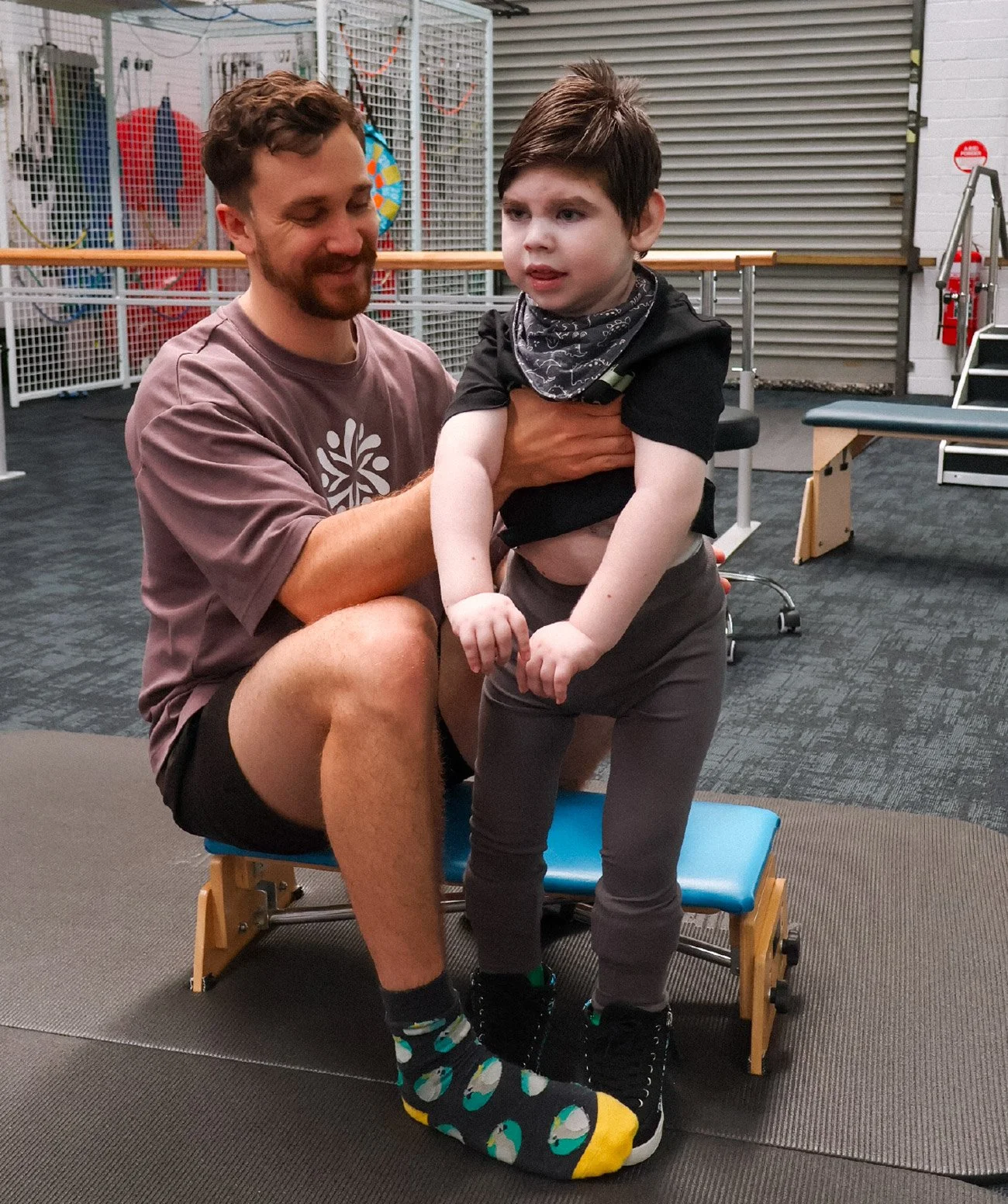 Therapist observing and assessing a child’s functional mobility and independence skills