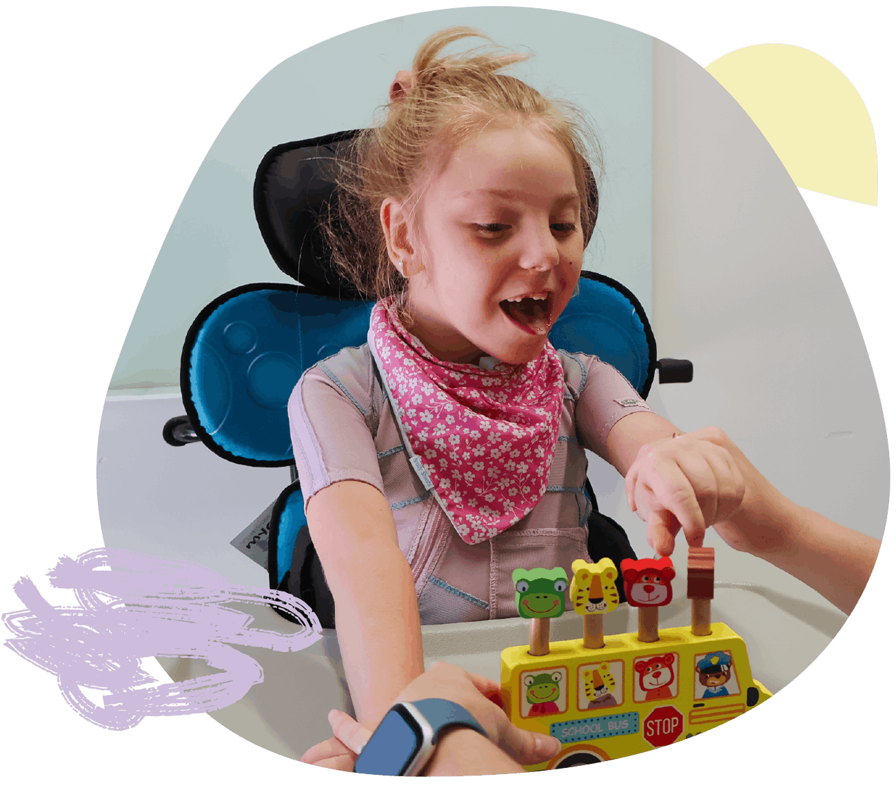 Child smiling during occupational therapy session, demonstrating progress and confidence